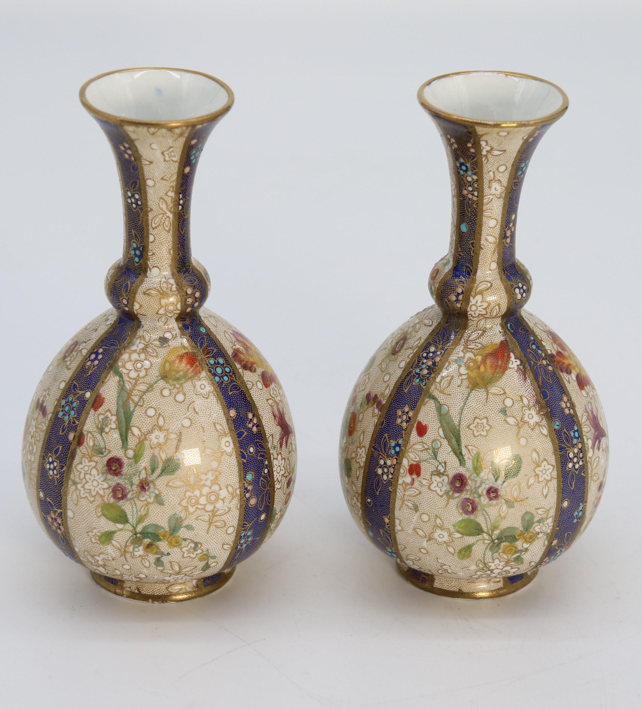 A pair of English early Carlton Ware enamelled and gilt floral vases, circa 1900 1