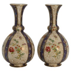 Antique A pair of English early Carlton Ware enamelled and gilt floral vases, circa 1900