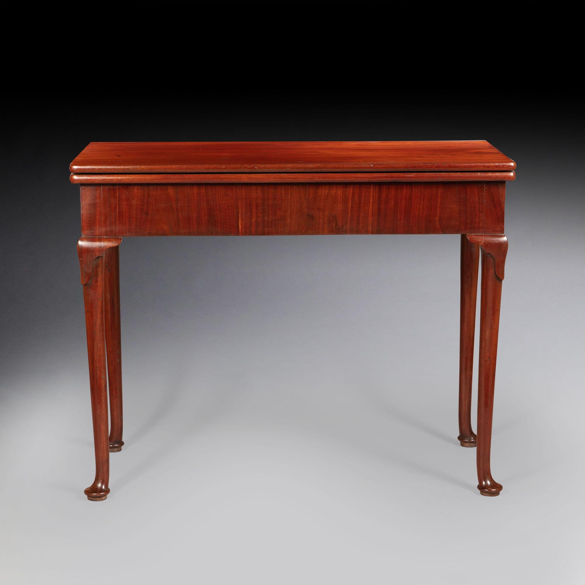 A pair of George I brown mahogany tea tables, the rectangular turnover leaf tops, above a plain frieze, concealing concertina actions, resting on cabriole legs, with pad feet.
 