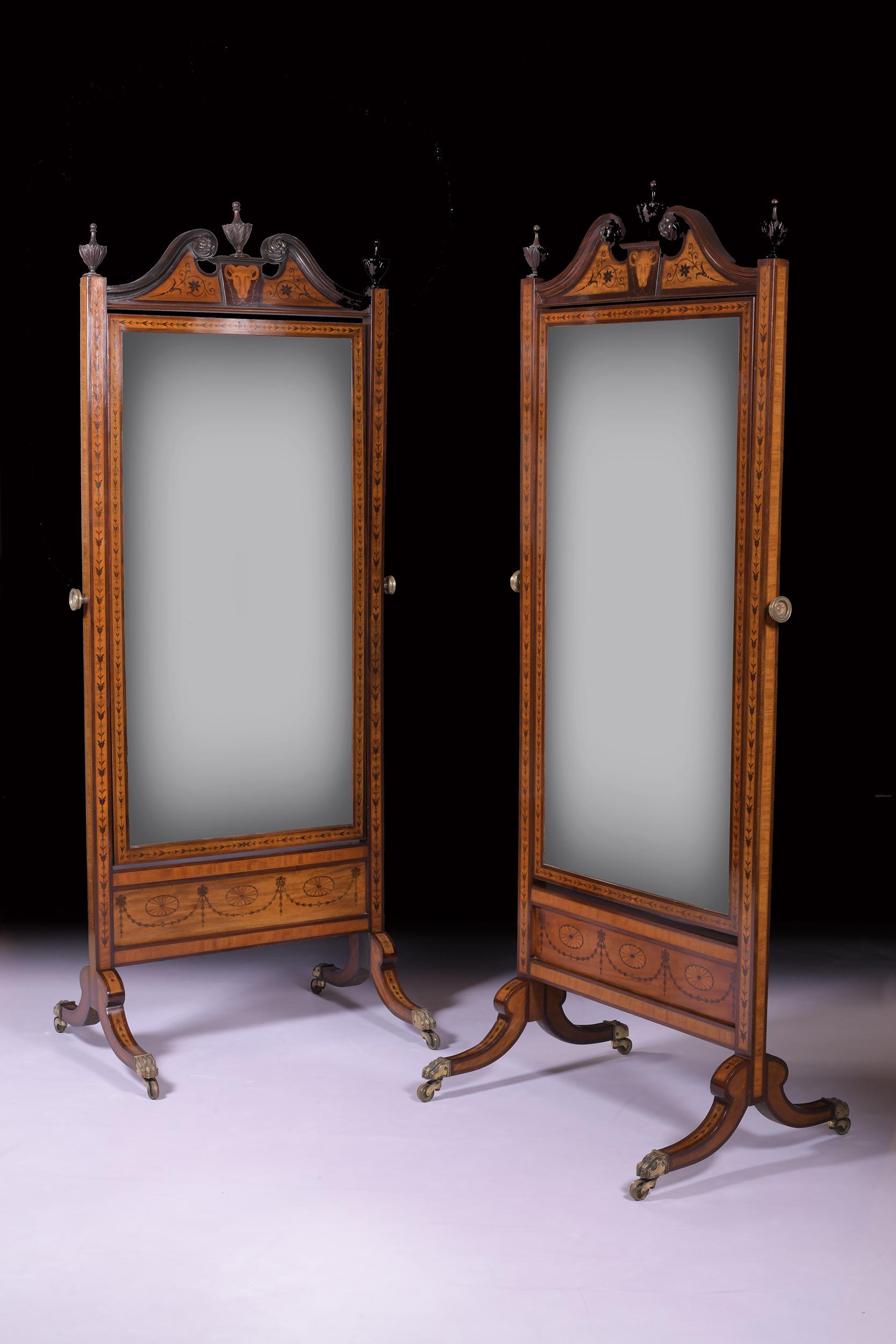 Exceptional pair of 19th century mahogany and inlaid cheval mirrors in the manner of William Moore (Dublin) in the Sheraton style, having broken swan inlaid pediment with central and side finials above original mirror plate in superb inlaid frame