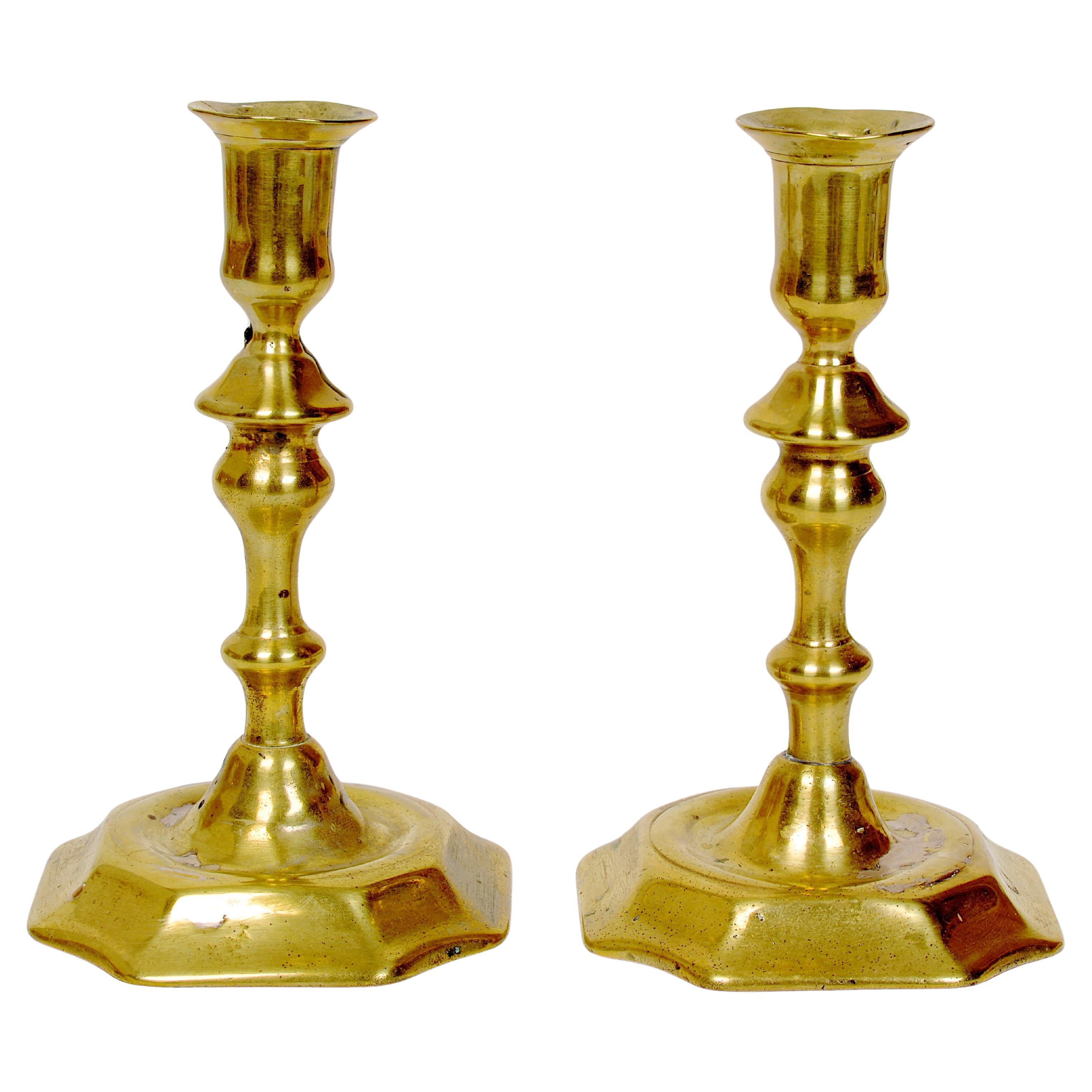 A Pair of English Queen Anne Brass Petal Base Candlesticks, c1730