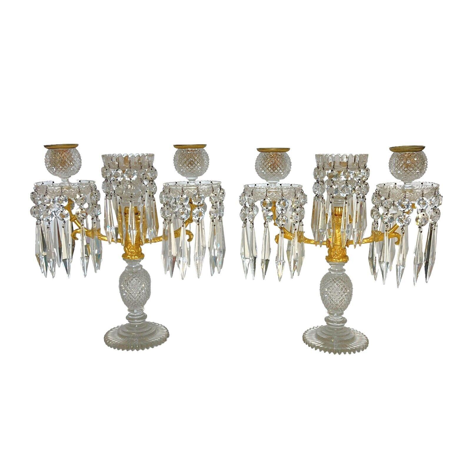 Indulge in the timeless elegance of these exquisite English Regency Candelabra, a stunning testament to the craftsmanship of the era. Crafted circa 1820 and attributed to the esteemed artisan John Blades, these ornate pieces blend the opulence of