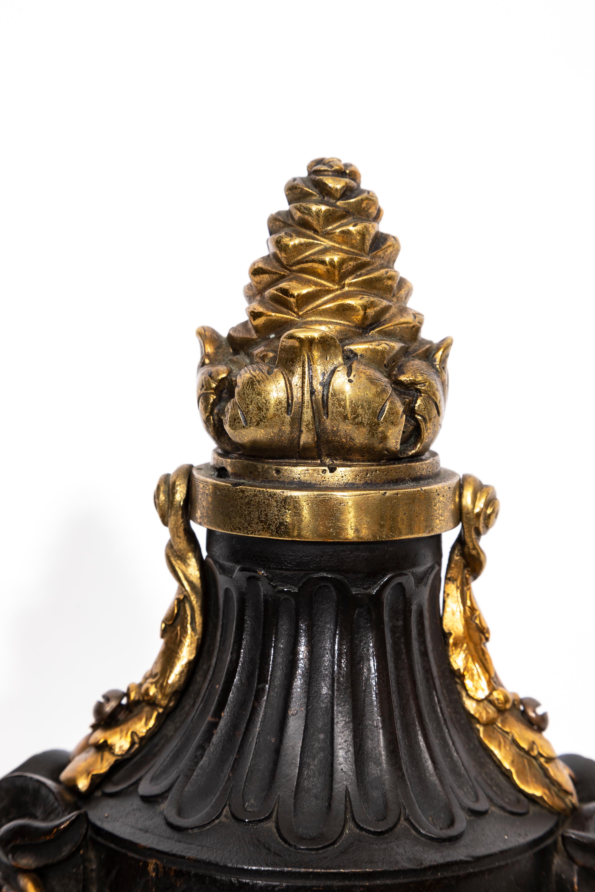 A Pair of English Regency Patinated and Ormolu Rams Head Andirons For Sale 4