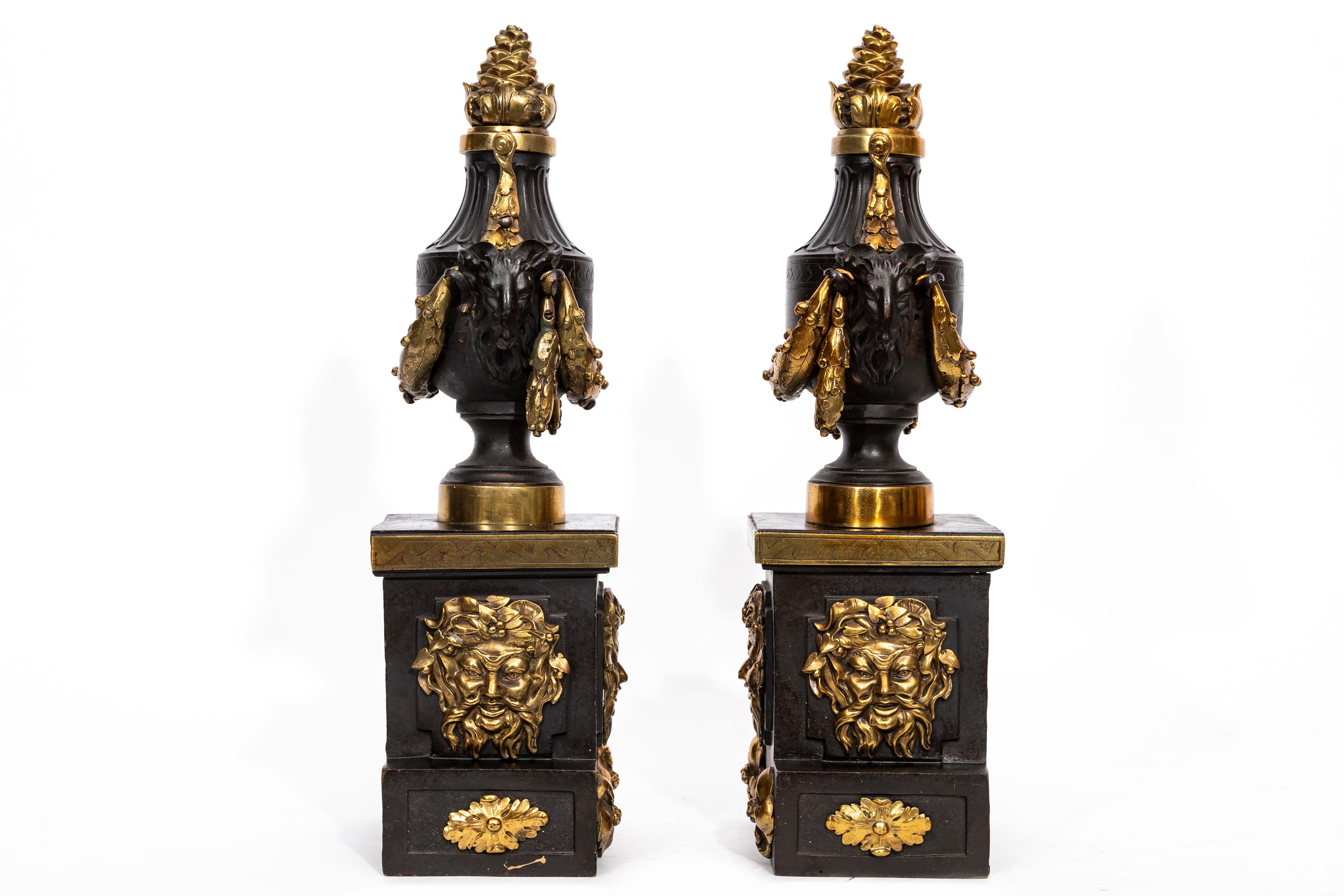 Early 19th Century A Pair of English Regency Patinated and Ormolu Rams Head Andirons For Sale