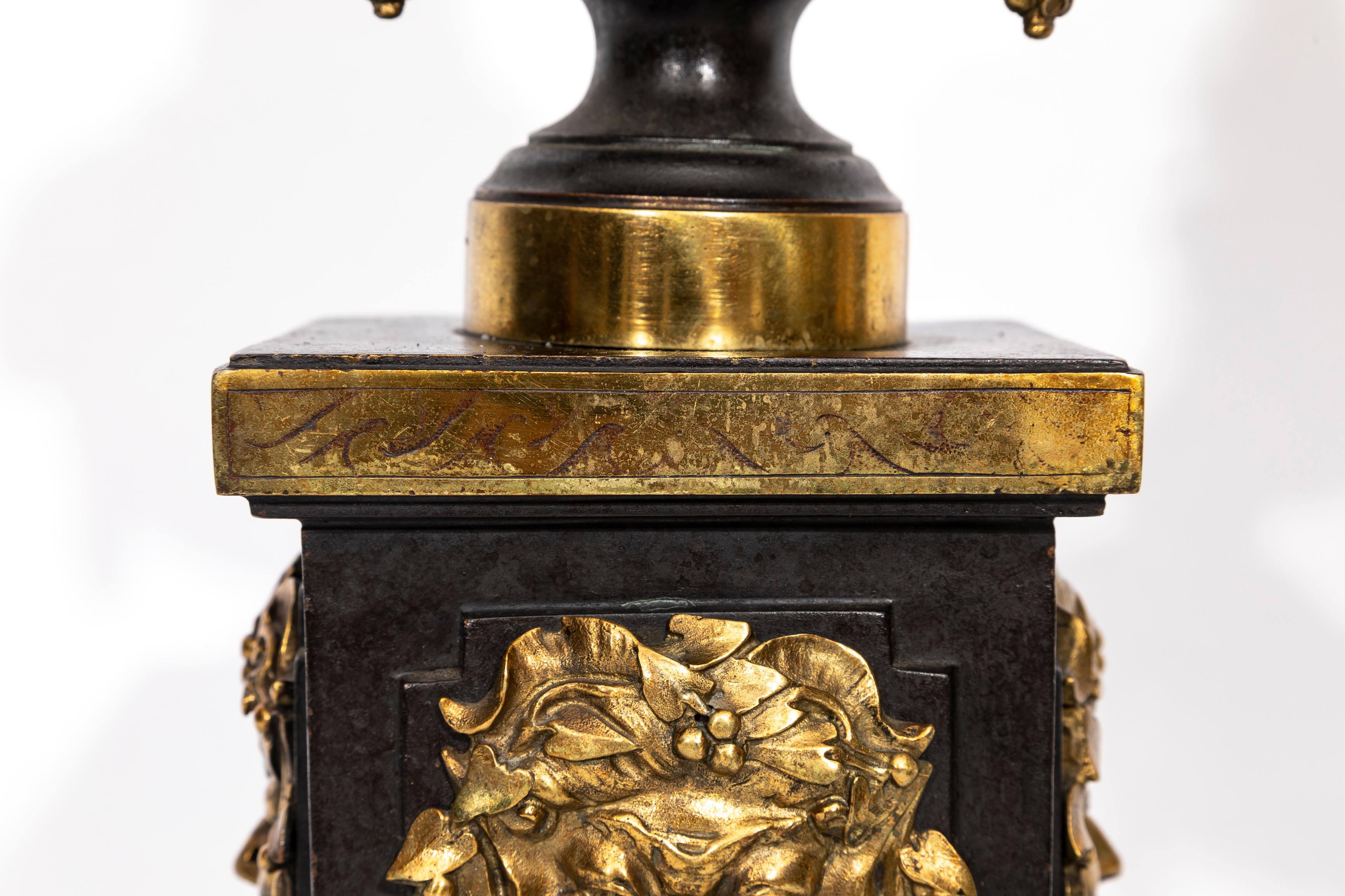 A Pair of English Regency Patinated and Ormolu Rams Head Andirons For Sale 1