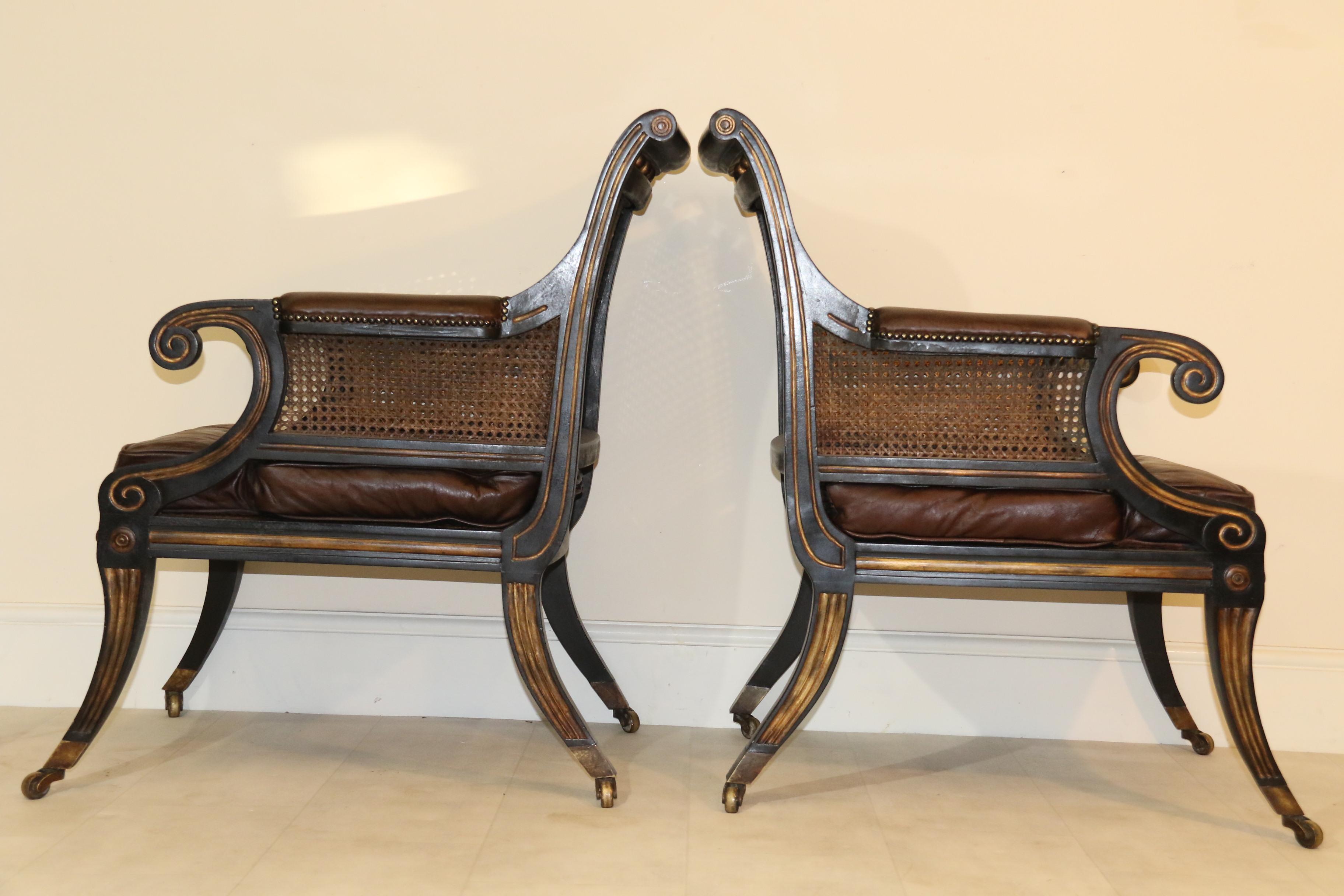 Early 20th Century Pair of English Regency Style Ebonized and Gilt Library Chairs For Sale