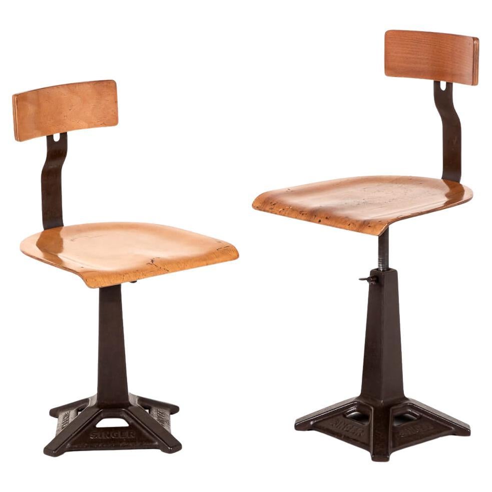 A pair of English Singer Machinist Work chairs