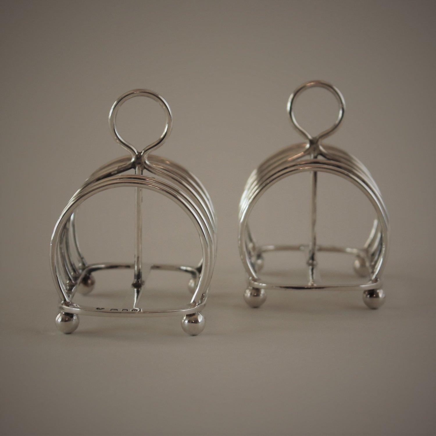 A pair of English sterling silver toast racks

Can also be used as desk item for storage cards & letters.

 Designer: Unknown
 Maker: Unknown
 Design #: n/a
 circa 1935
 Dimensions: 3