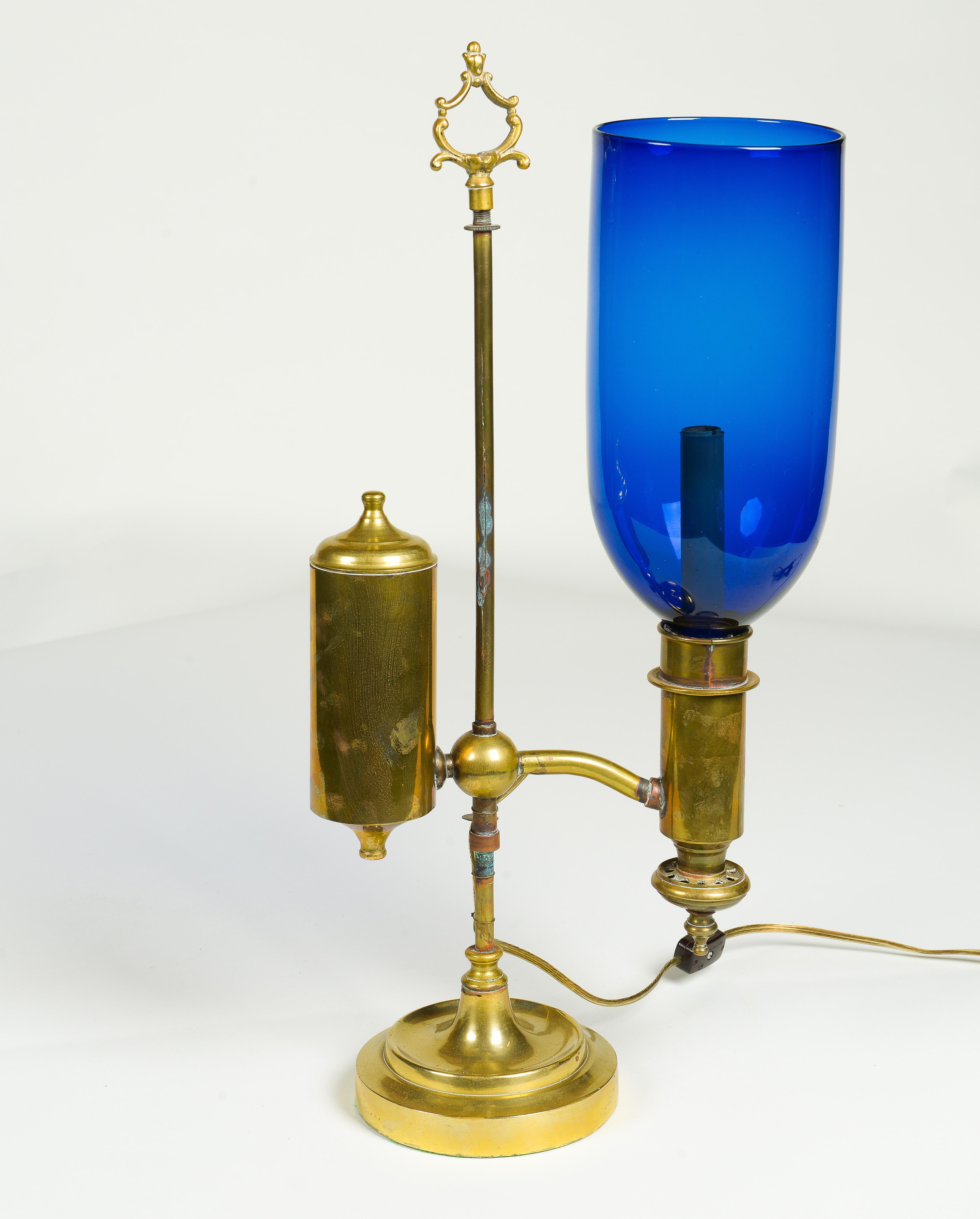 A Pair of English Student Brass Lamps with Blue Hurricane Shades 1