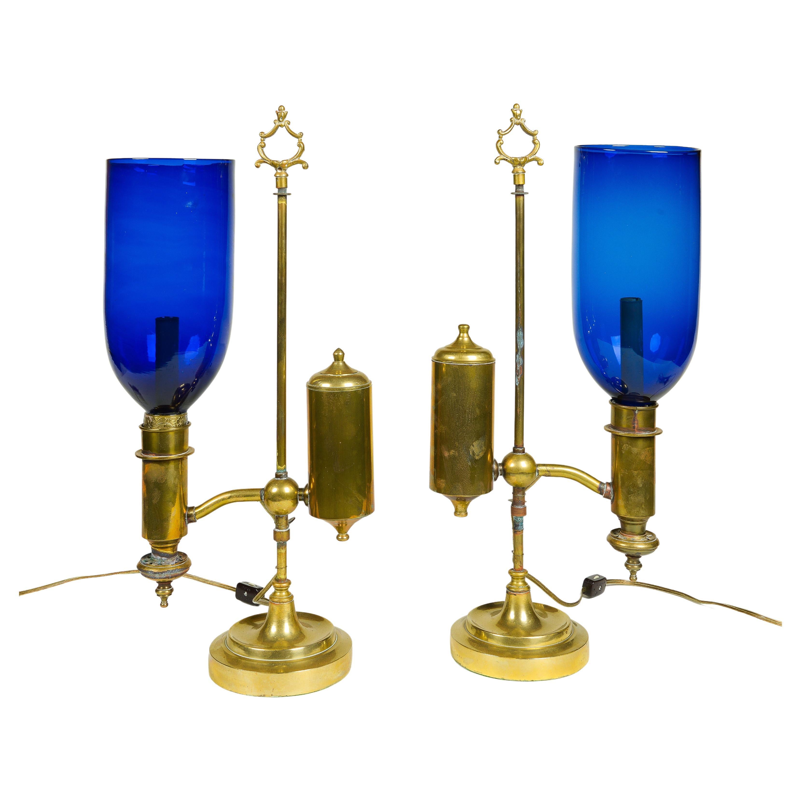 A Pair of English Student Brass Lamps with Blue Hurricane Shades