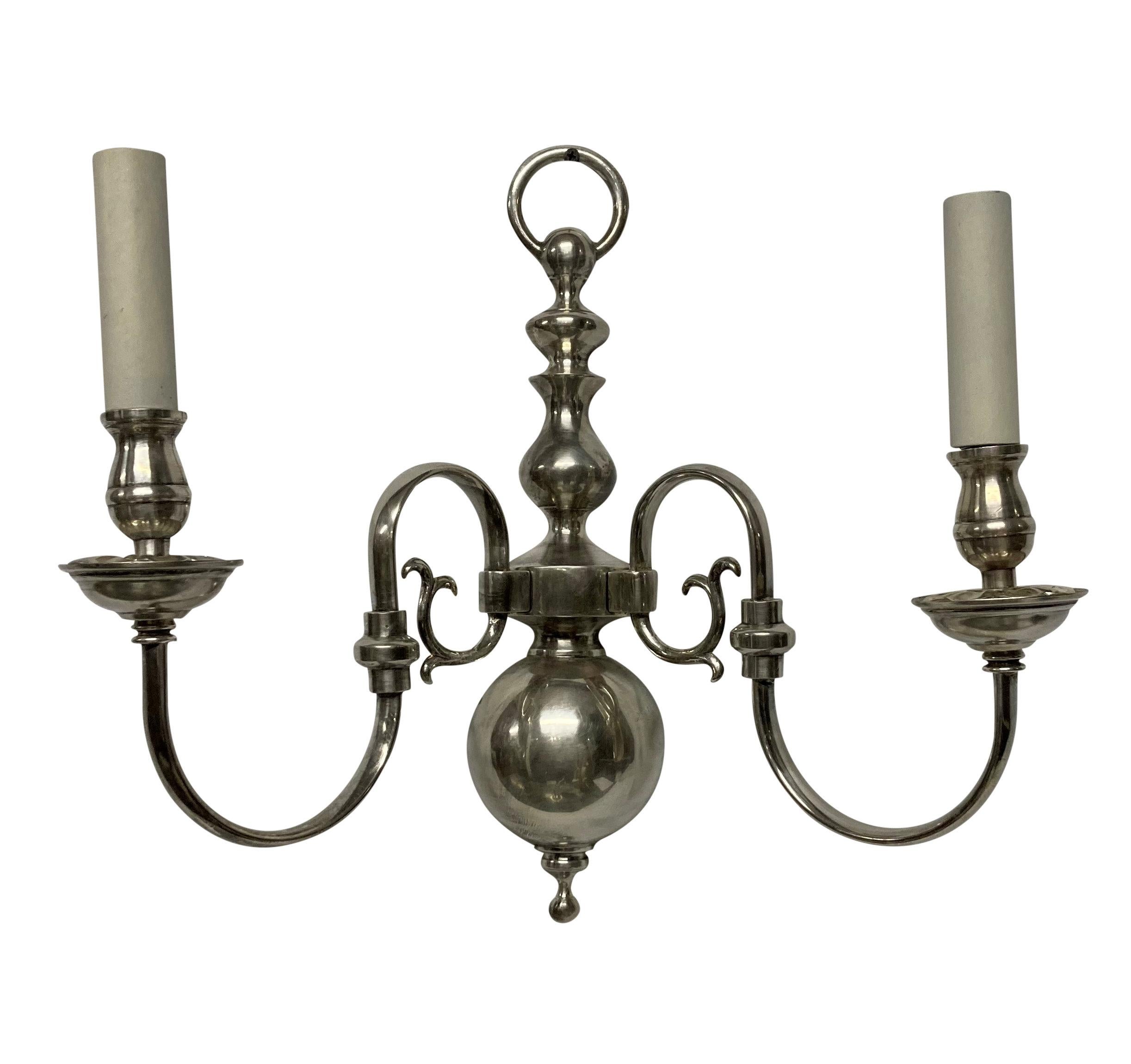 A pair of English XVII Century style twin branch silver plated wall lights.