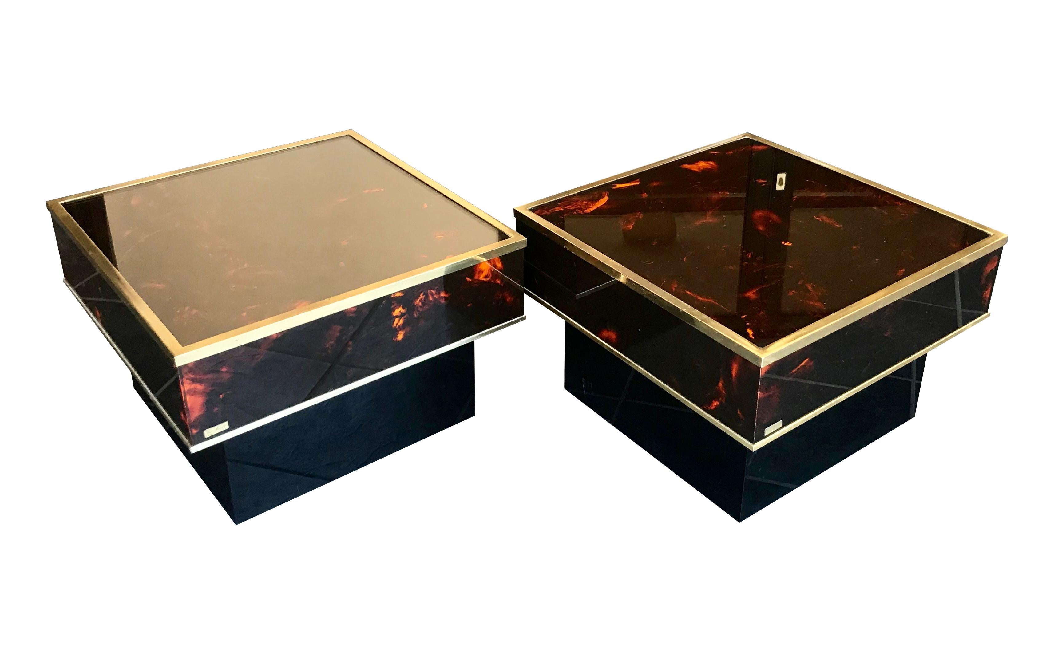 A lovely pair of Eric Maville faux tortoiseshell side tables, with brass edging and glass tops mounted on a black laminated base. Each with 