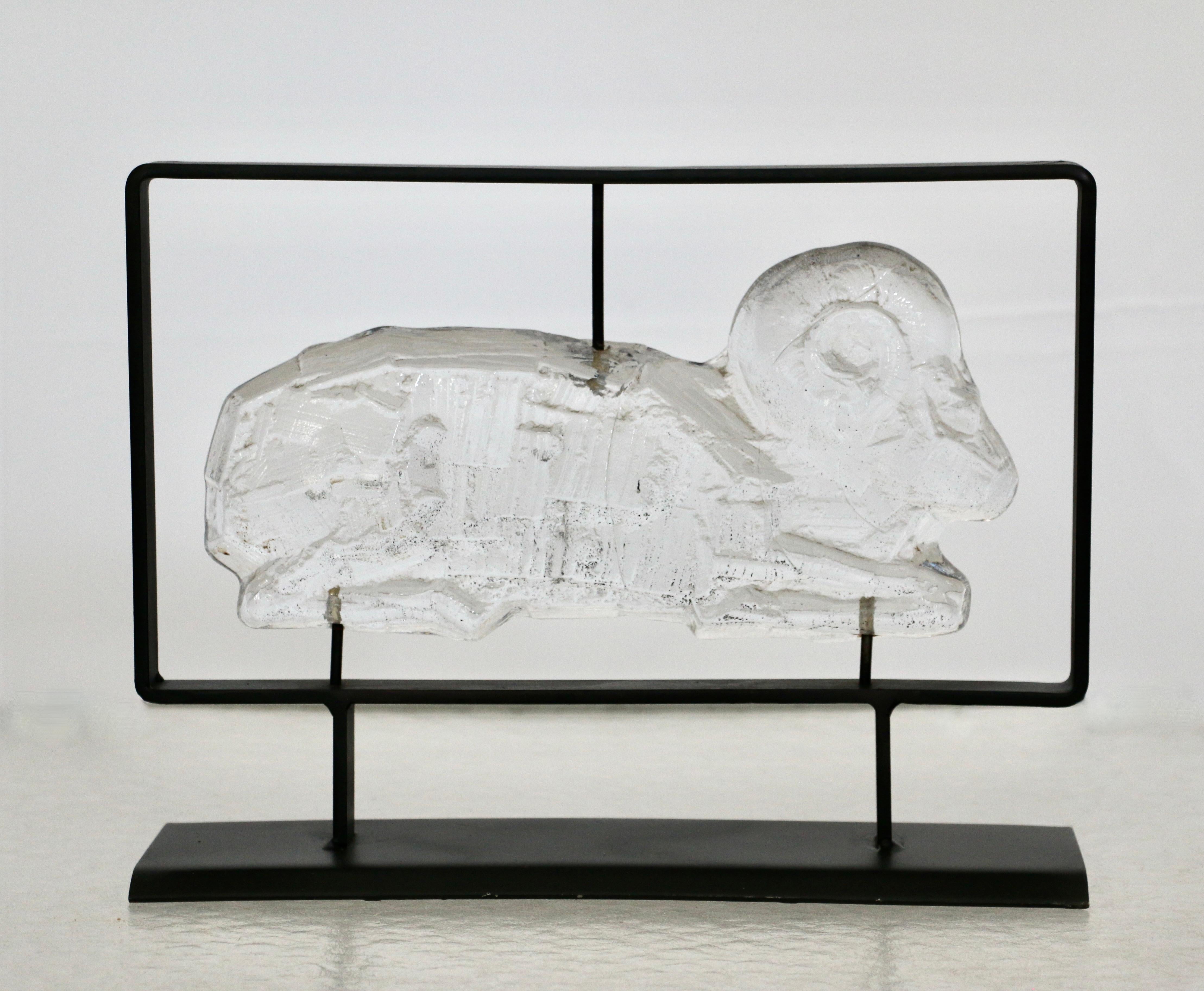 A pair of molded clear glass sculptures of a reclining ram and lion set in a black lacquered metal structure, Erik Sylvester HÖGLUND (1932-1998) for BODA SMIDE, Sweden, 70s.
