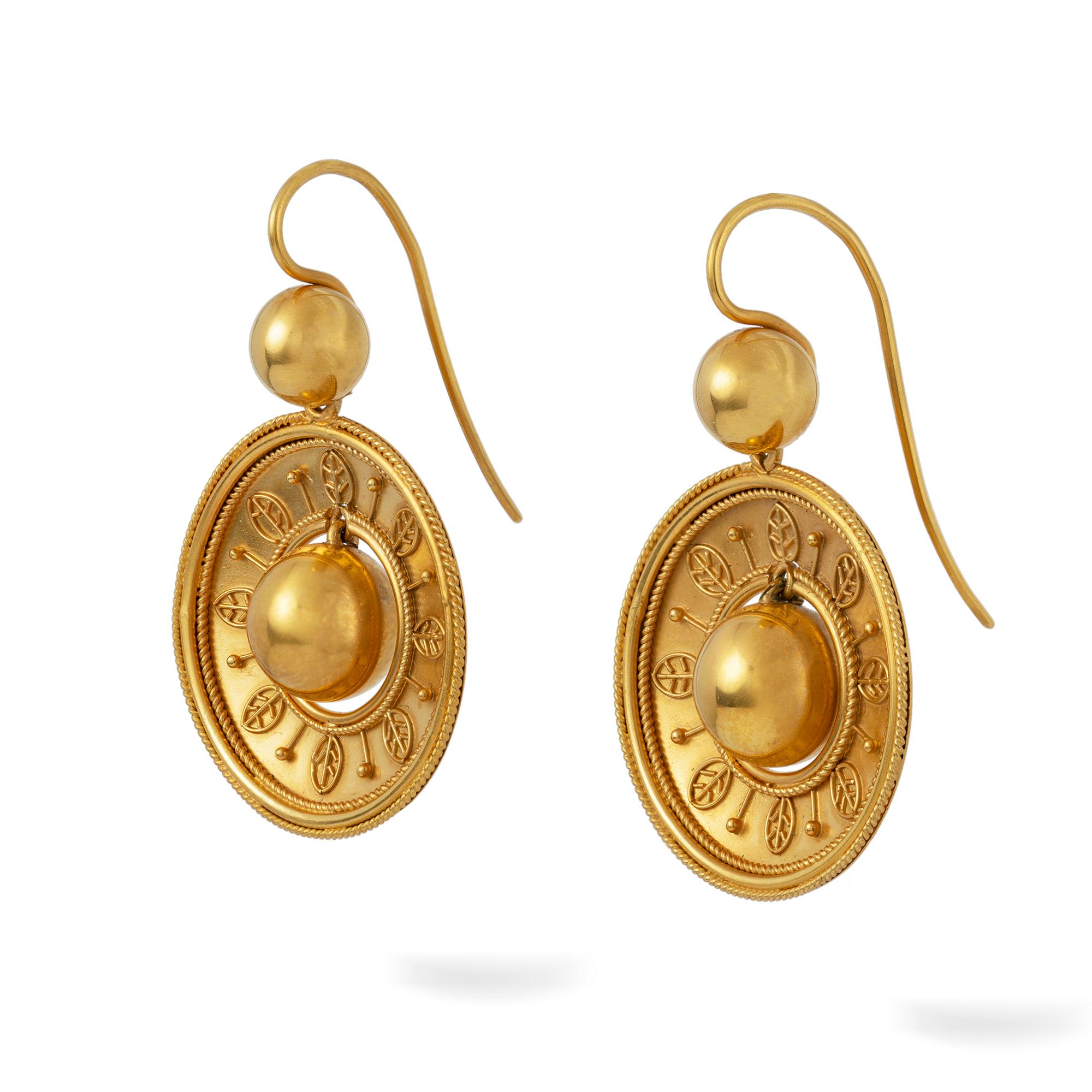 A pair of Etruscan Revival gold drop earrings, each with a golden ball to the centre hanging from a circular frame with fine wirework decorations, all suspended by a smaller ball, with gold hook fittings, measuring approximately 3.3 x 2.1cm,  gross