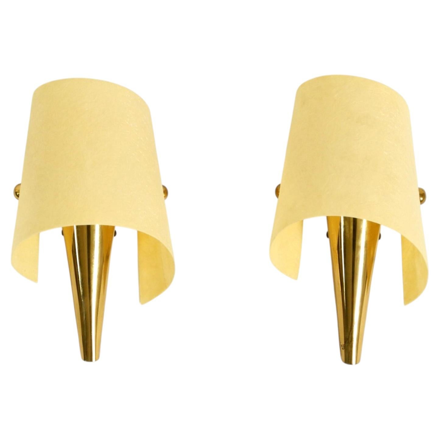 A pair of exceptional Mid-Century Modern brass wall lamps with fiberglass shade