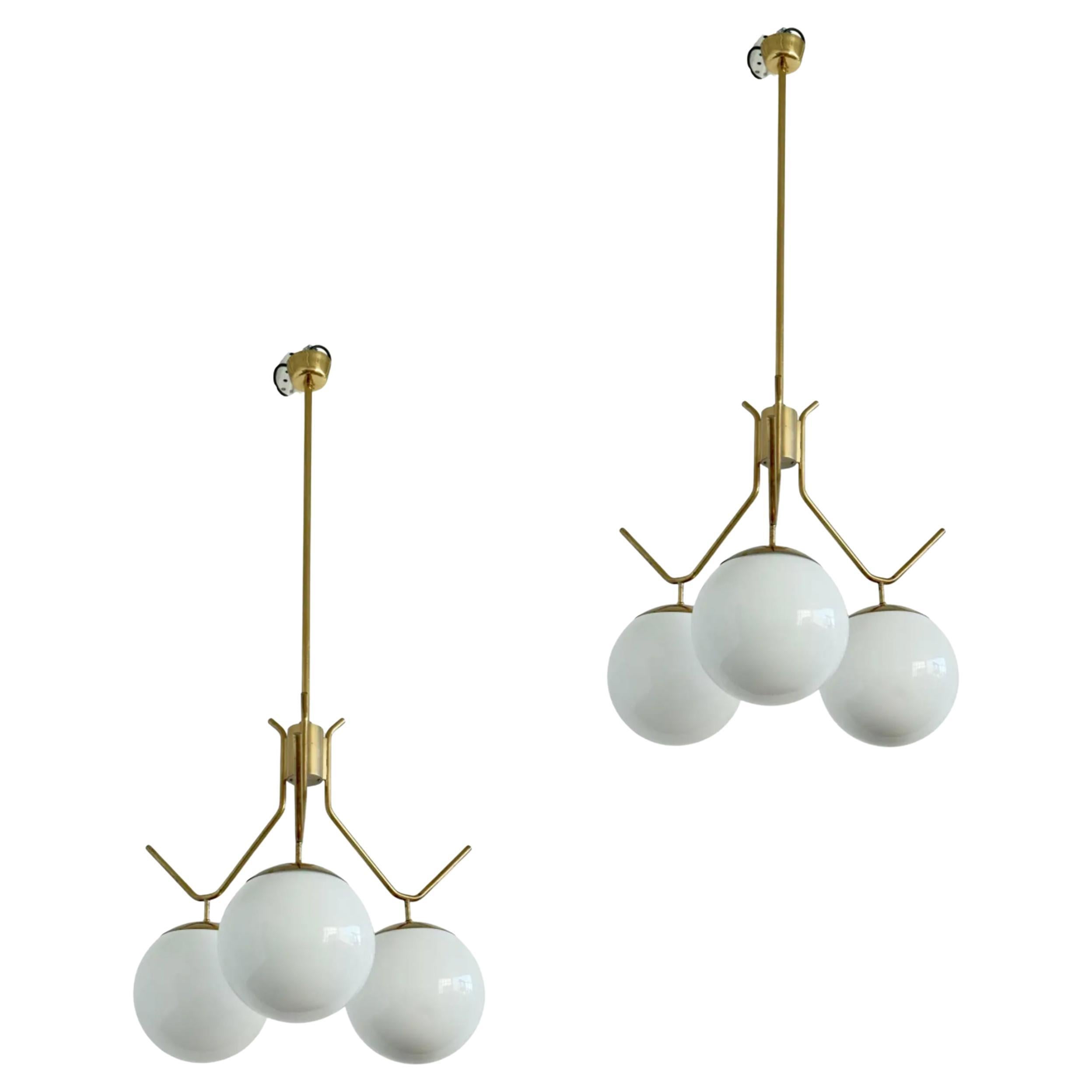 A Pair of Extra Large lightings by Pavo Tynell For Sale