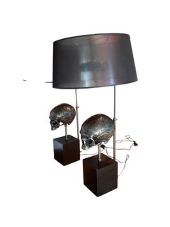 A pair of Extruder Skull Table Lamps, designed by the luxury brand Eichholtz