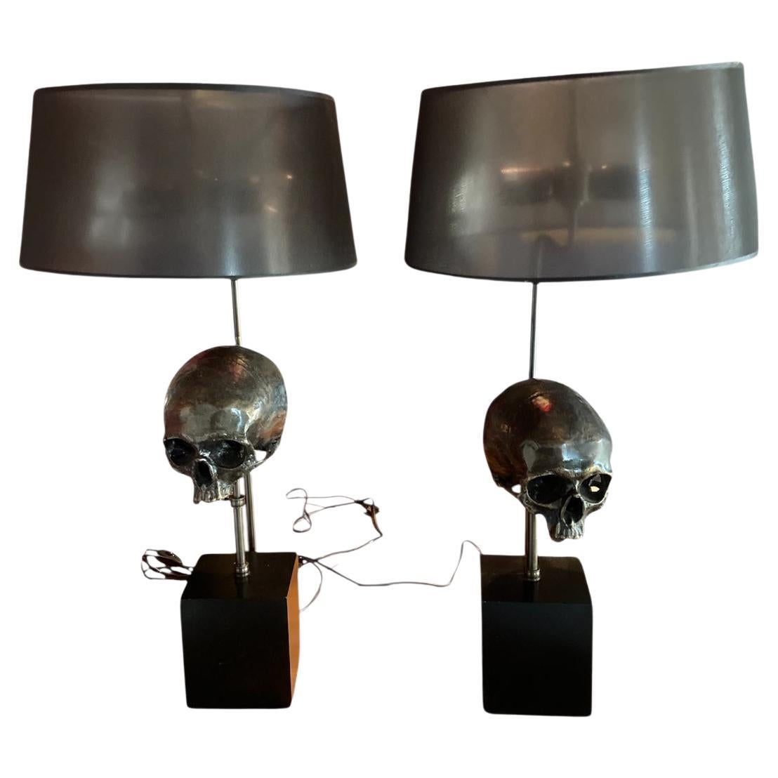 A pair of Extruder Skull Table Lamps, designed by the luxury brand Eichholtz