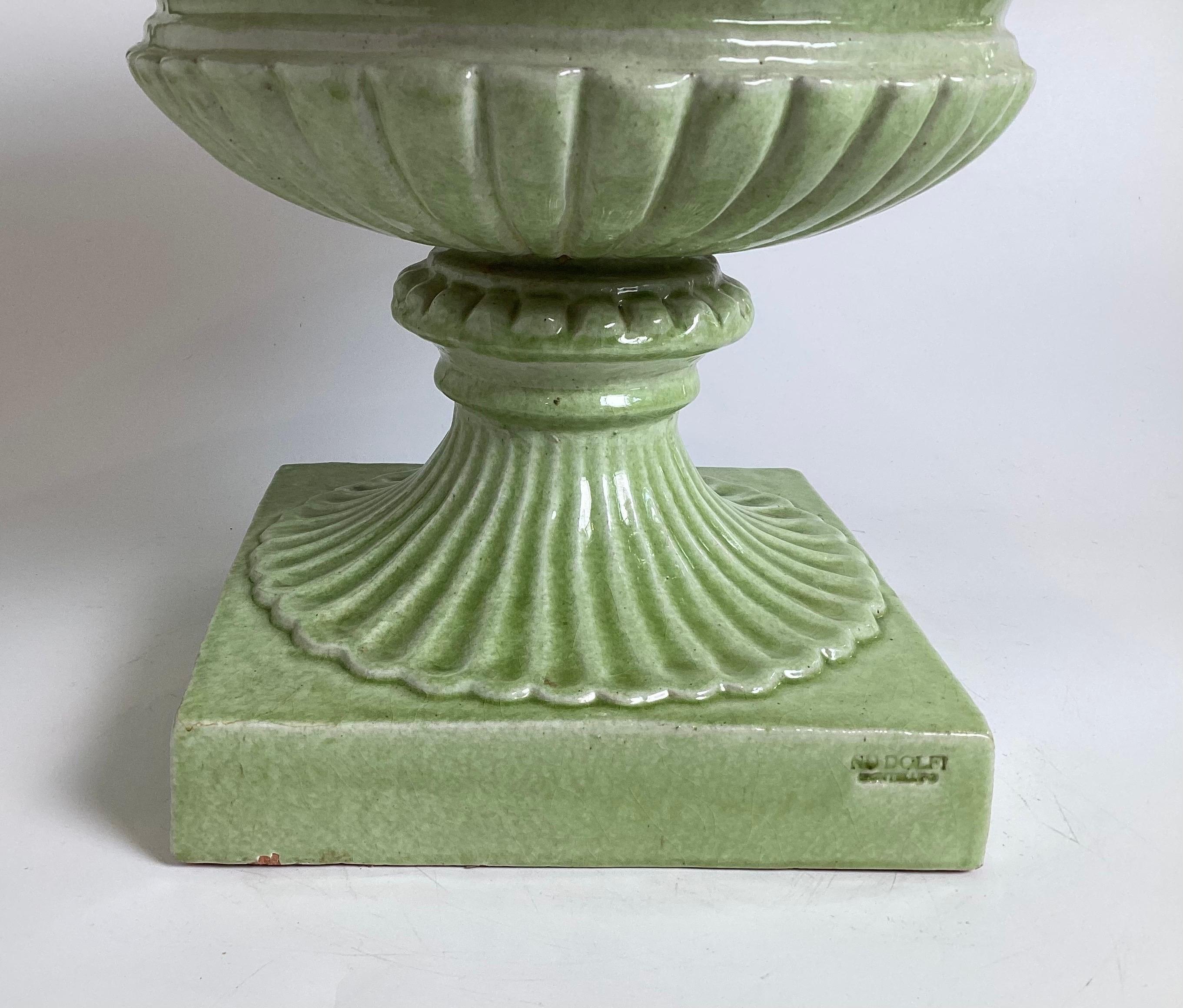 A Pair of Faience Green Italian Urns, retailed by Bergdorf Goodman In Excellent Condition For Sale In Lambertville, NJ
