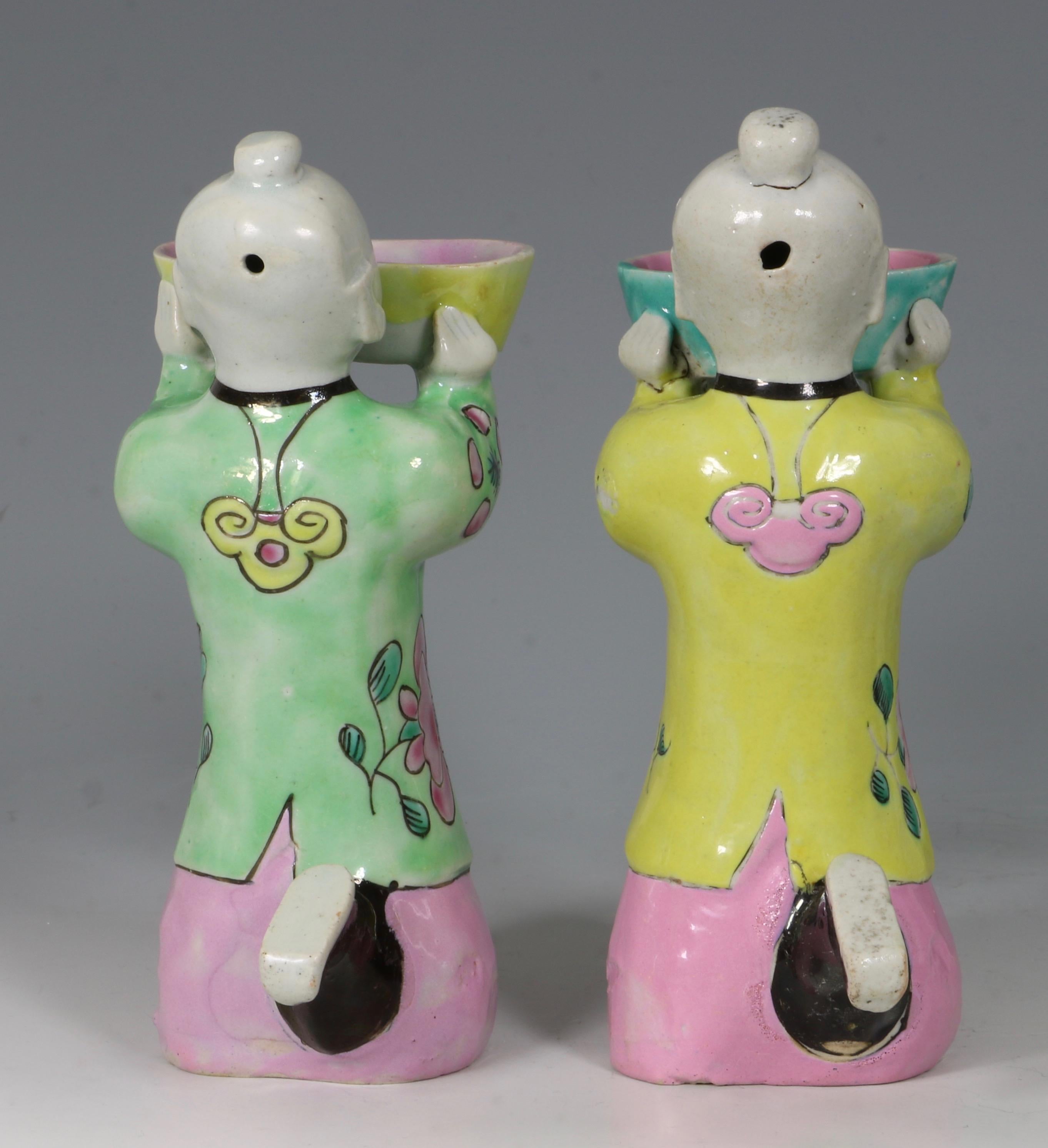 Pair of Chinese Porcelain Famille Rose Kneeling Boys, 18th-19th Century In Fair Condition For Sale In Frome, Somerset