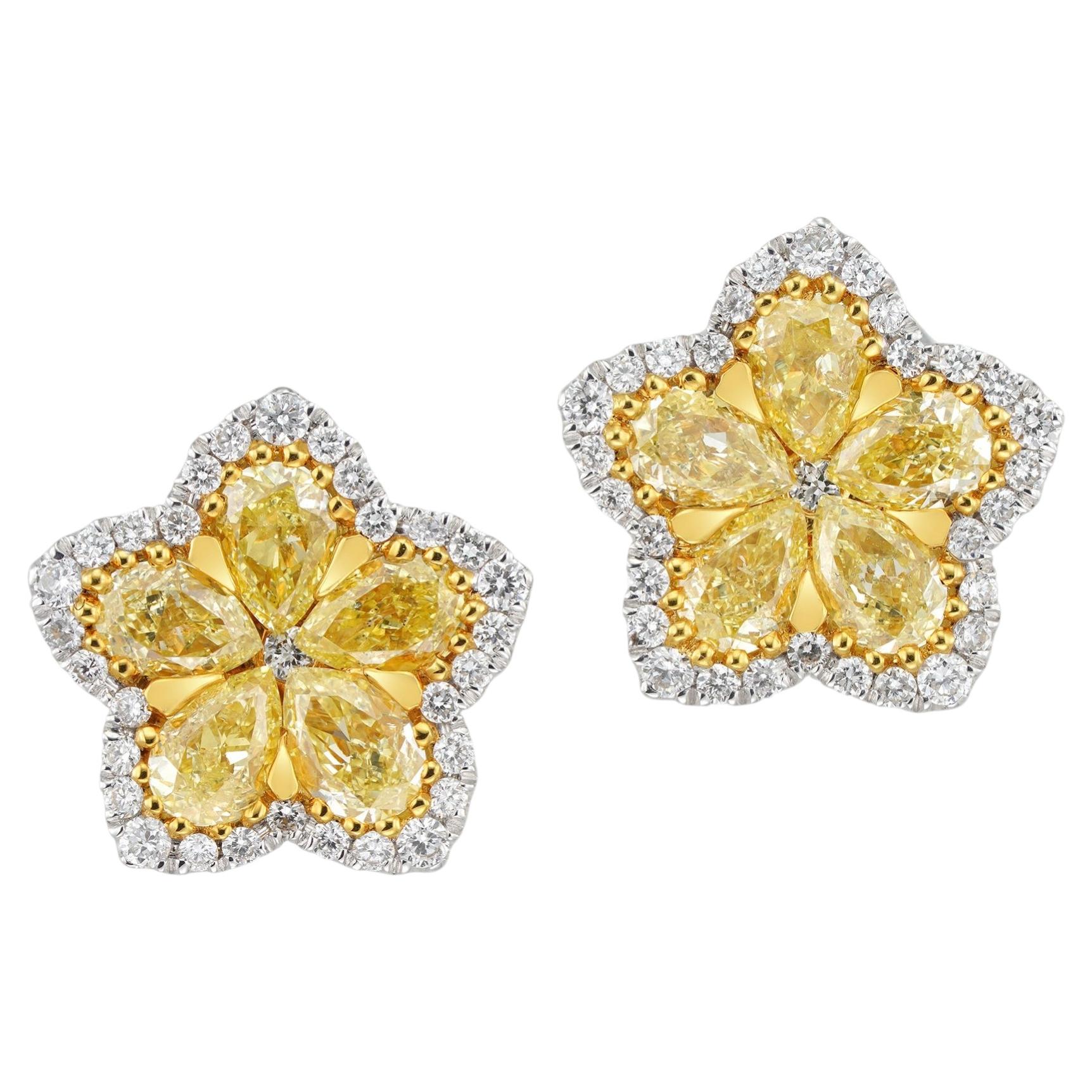 A pair of fancy yellow diamond flower cluster earrings For Sale