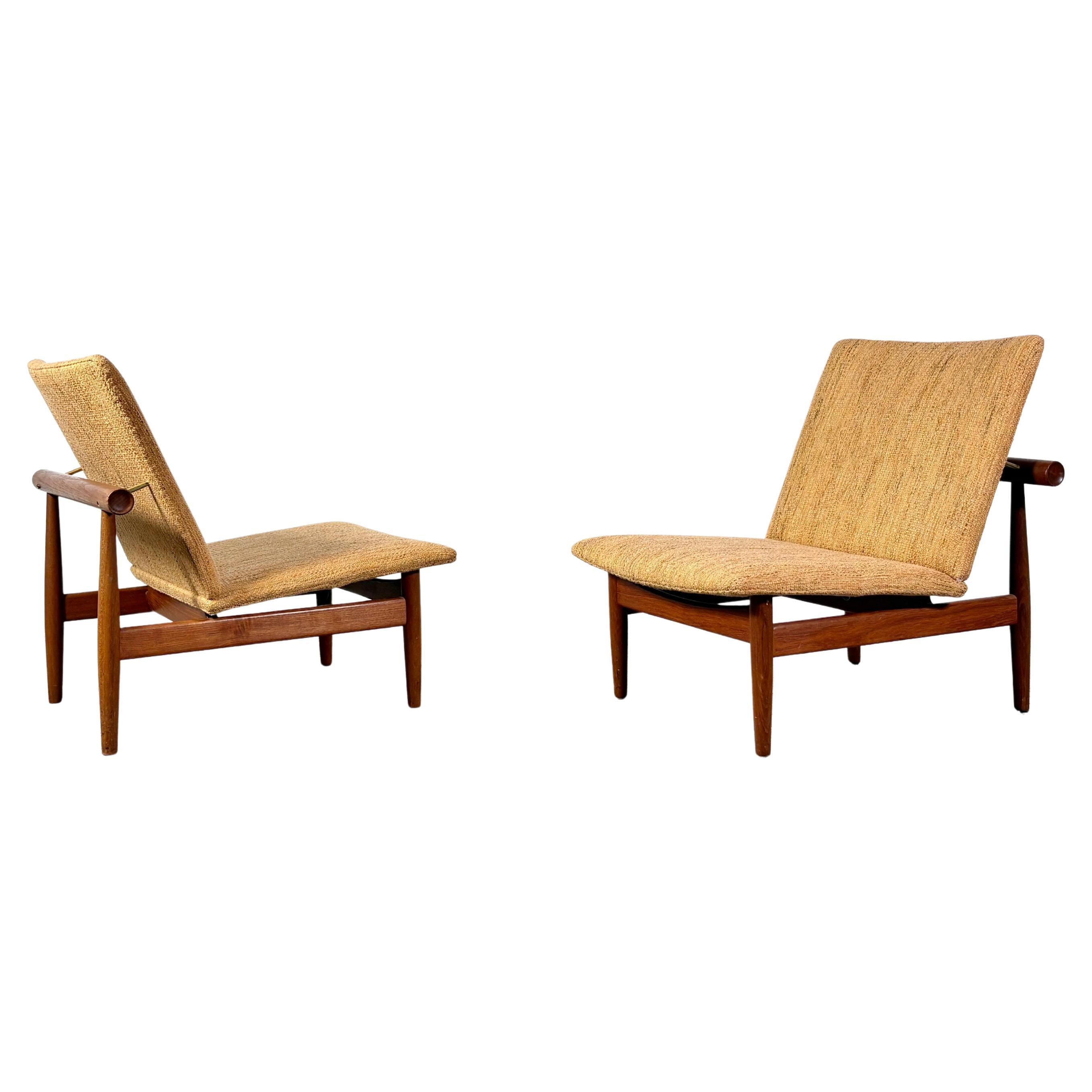 A pair of FD137 Japan lounge chairs designed by Finn Juhl
