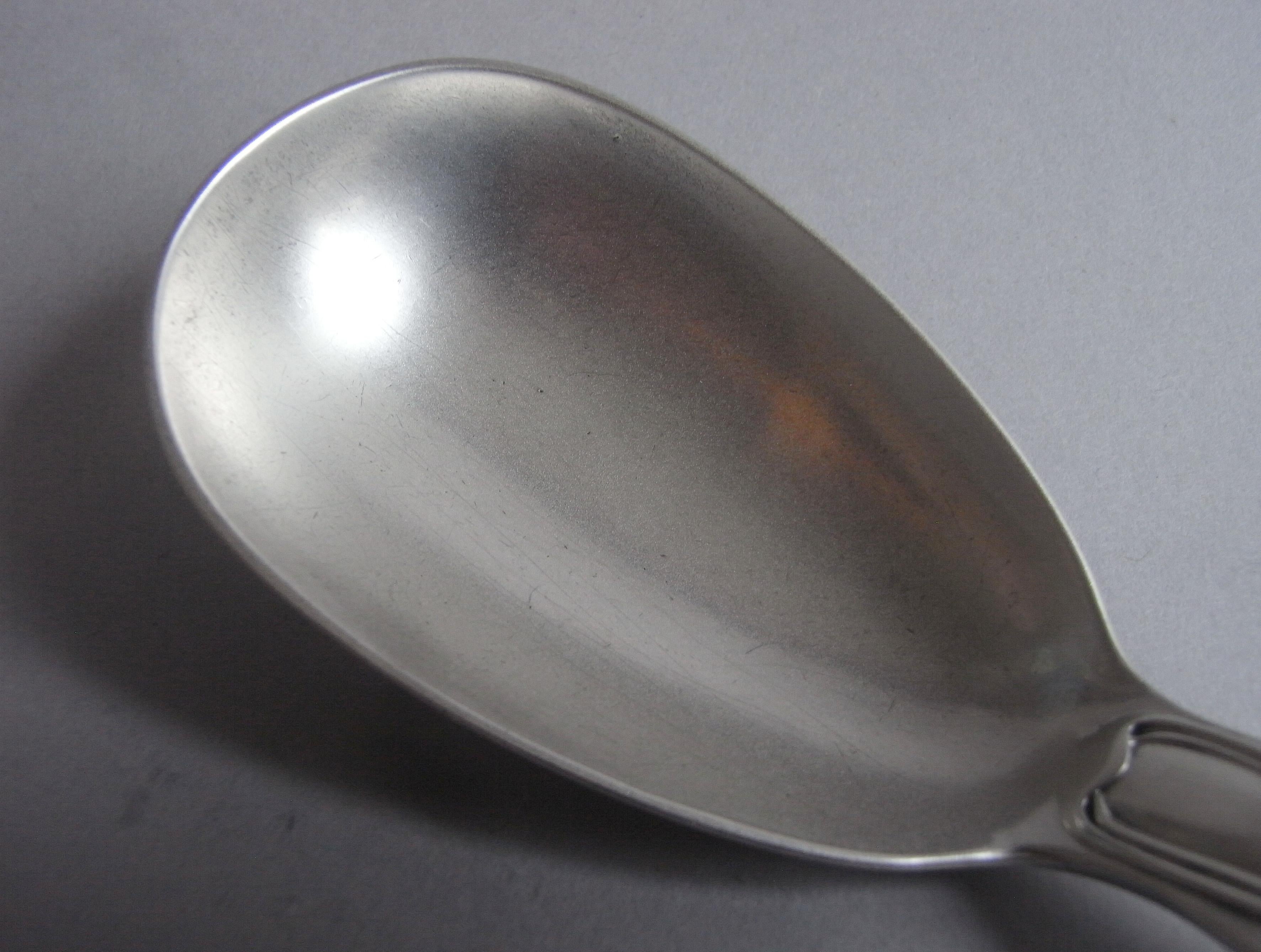 These very fine salad servers are modeled in the fiddle and thread pattern and are of a quite excellent thick gauge of silver. The spoon has an unusual egg shaped bowl and the fork six times. The top of each stem is engraved with a contemporary