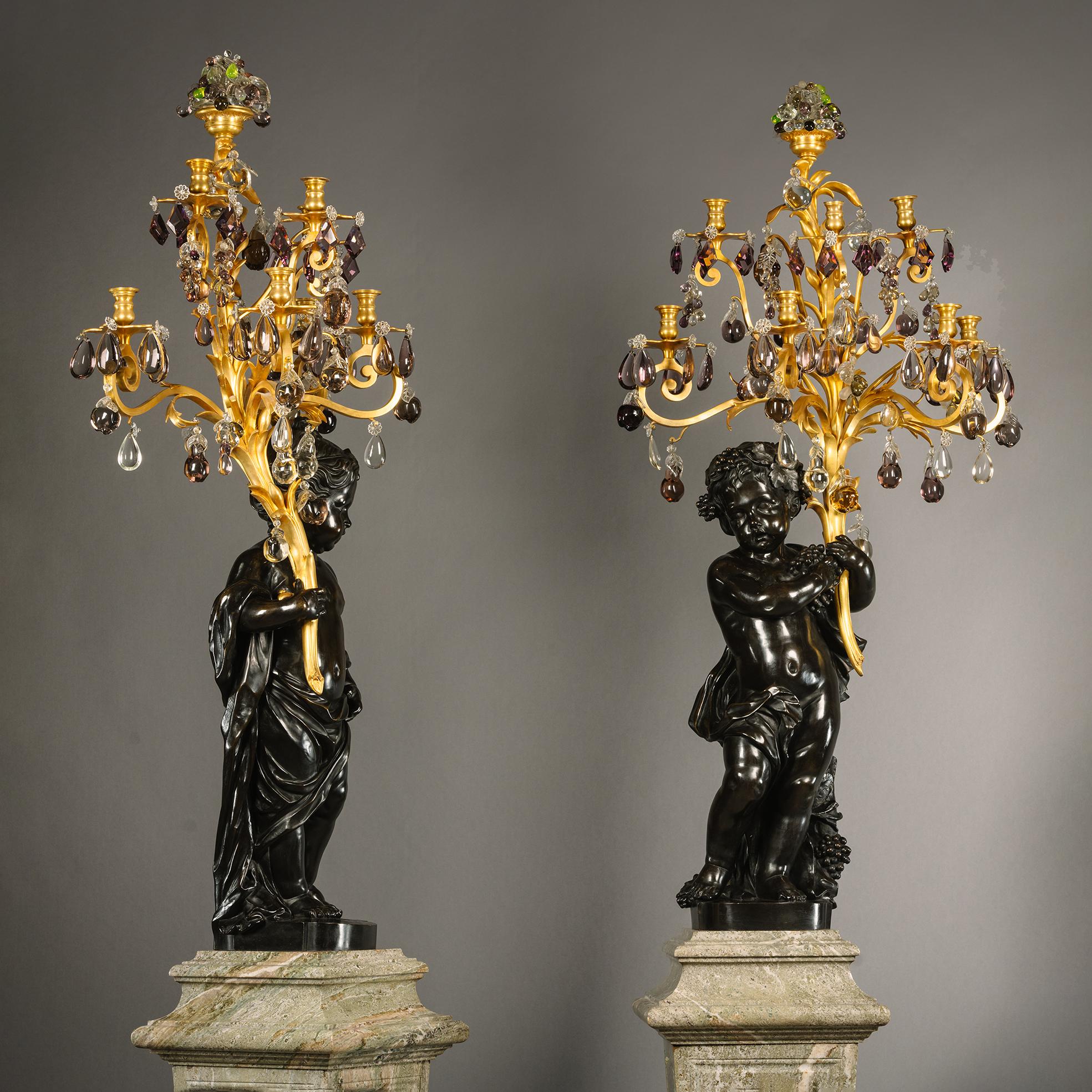 A Pair of Figural Putto Seven-Light Candelabra, On Green Marble Pedestals In Good Condition For Sale In Brighton, West Sussex