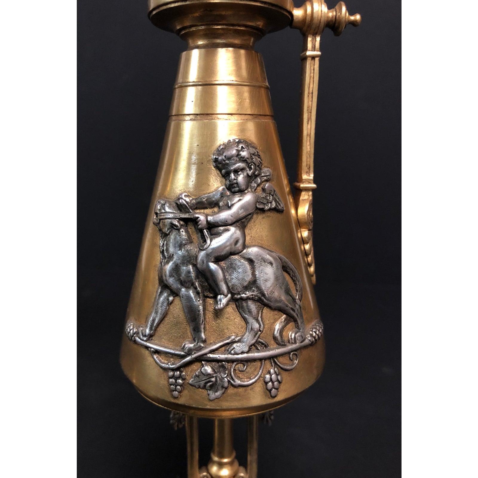 A fine pair of 19th century figural urns doré and silver over bronze. Pair gilt and silver over bronze figural ewers. Fine quality casting. Cupid’s riding panthers in the manor of Albert-Ernest Carrier-Belleuse. French (1824-1887).