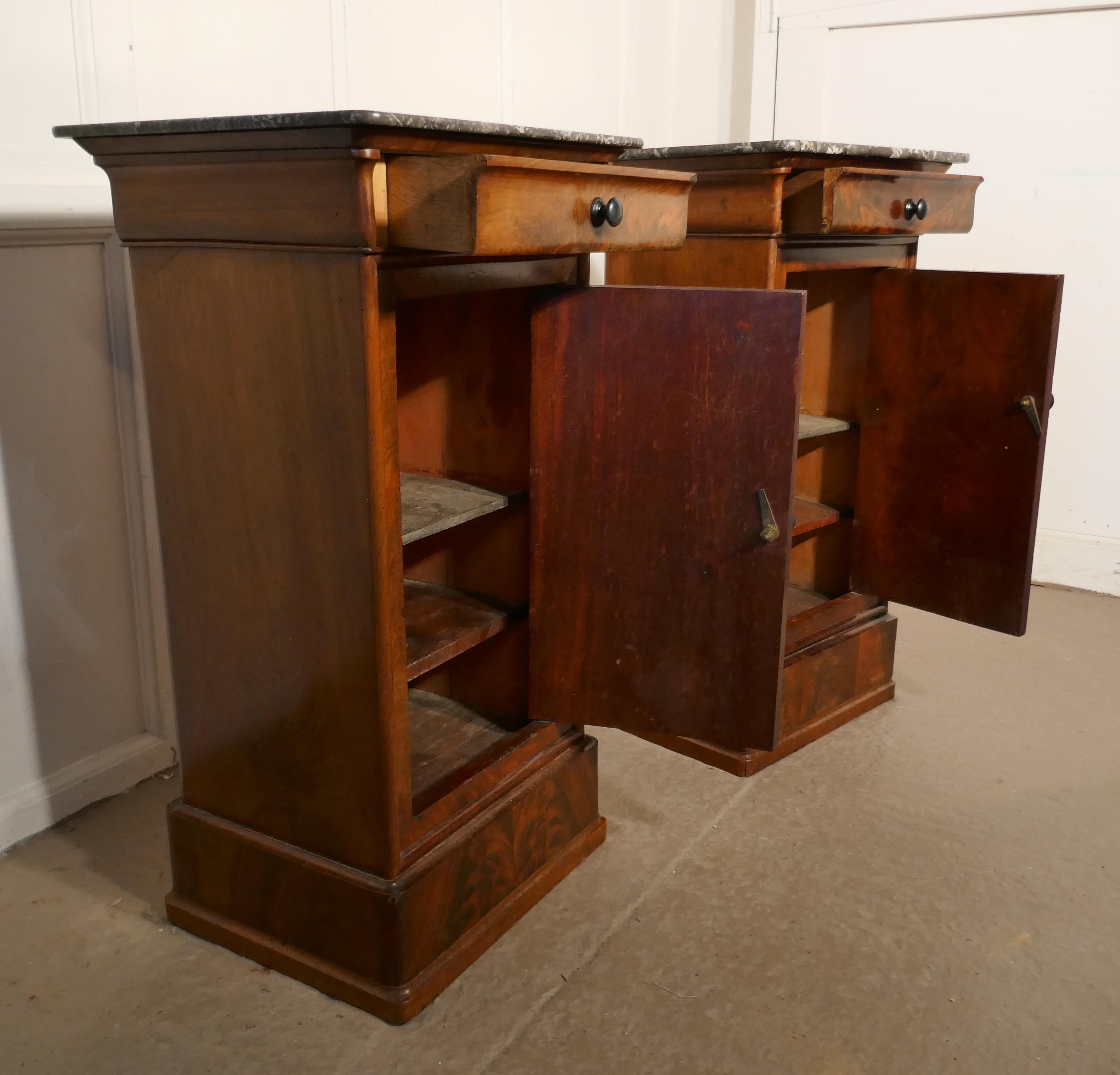 A pair of figured mahogany bedside cupboards

This is a charming and attractive pair, they are made in mahogany which has a glorious grain to the wood, they each have a drawer and a shelved cupboard beneath. The cabinets have grey marble tops