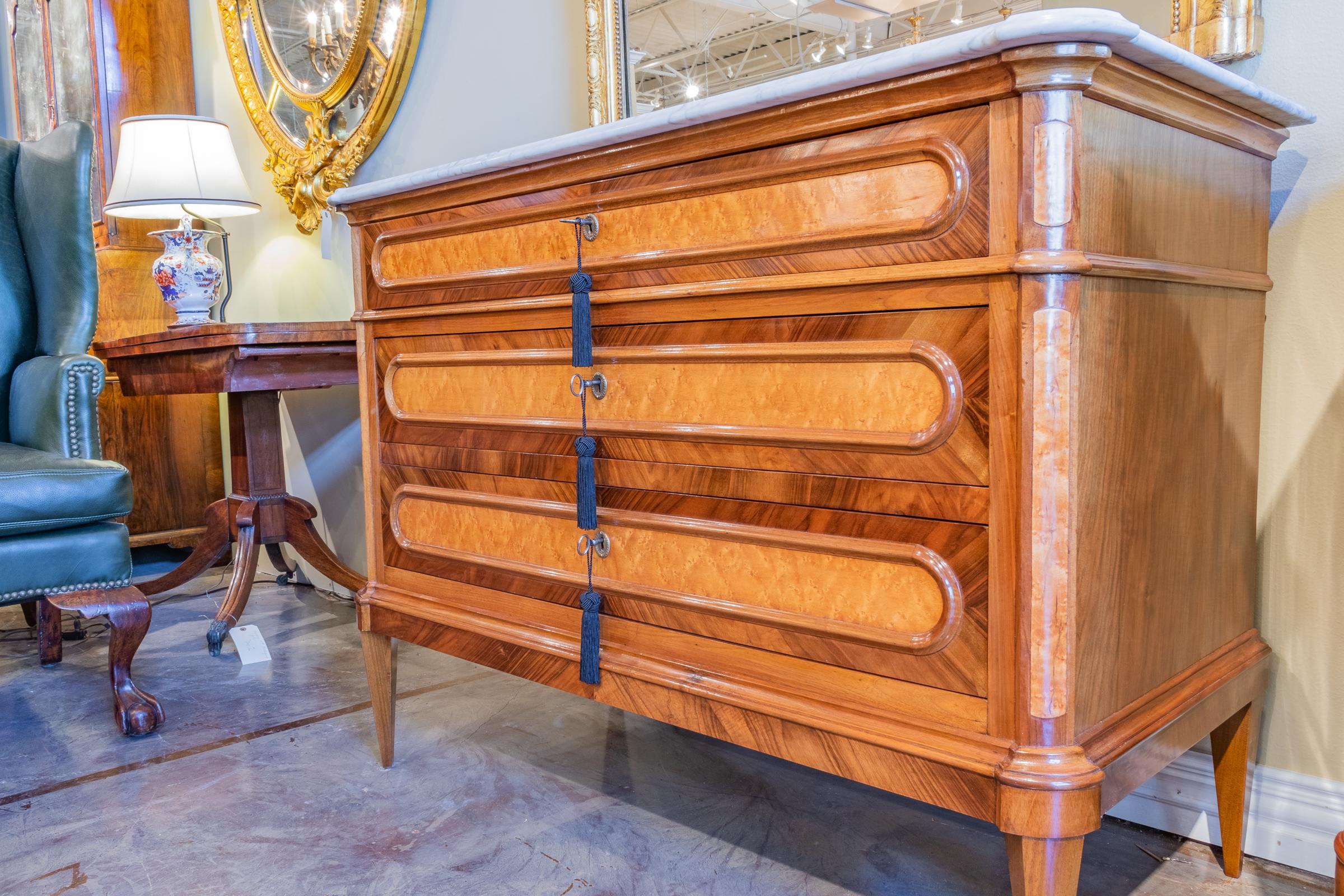 A fine pair of 19th century Italian Louis XVI Carrera marble-top commodes. Fine walnut and fruitwoods.