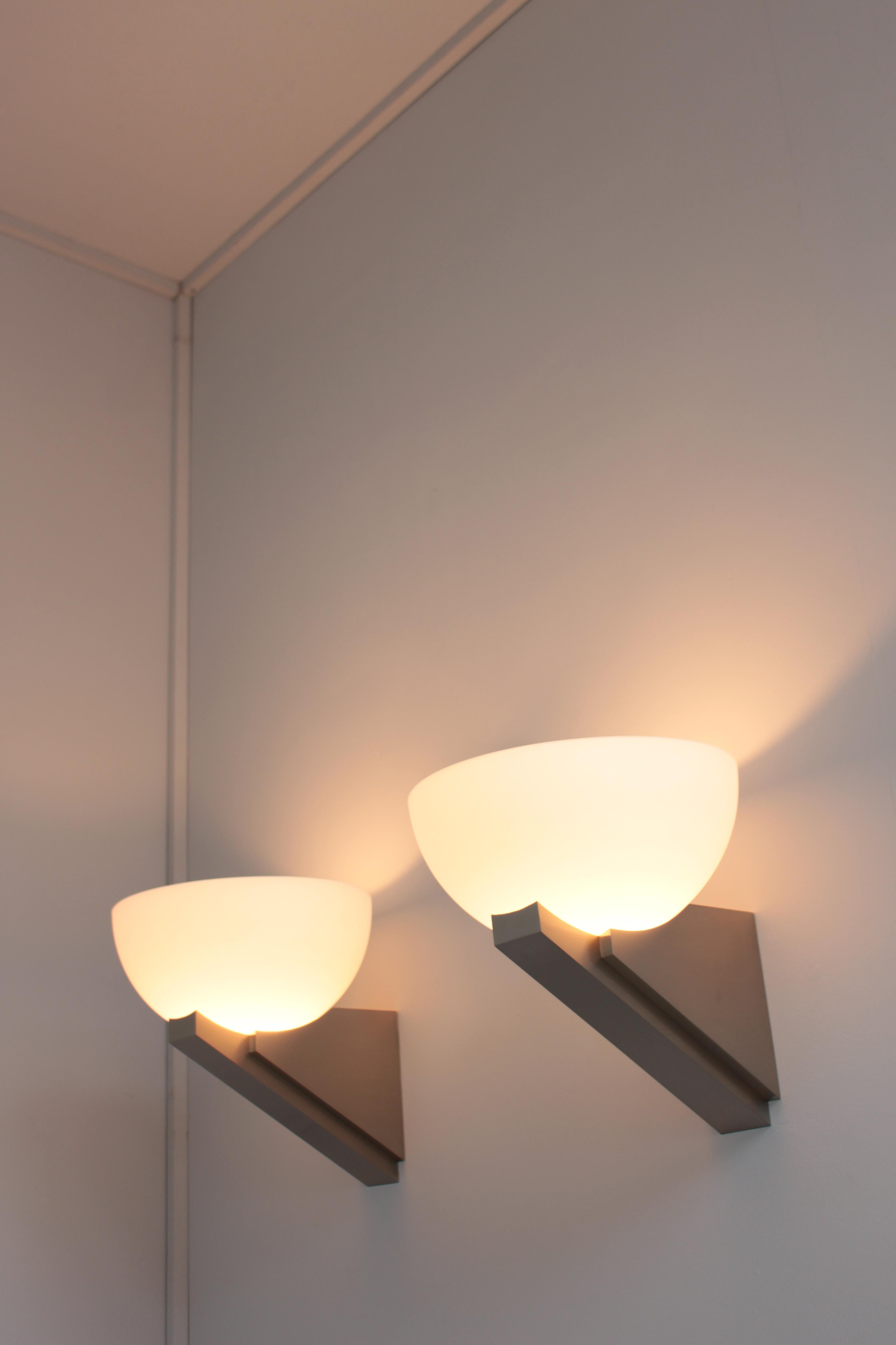 A pair of Fine French Art Deco Brushed Nickel and Glass Sconces by Jean Perzel In Good Condition For Sale In Long Island City, NY