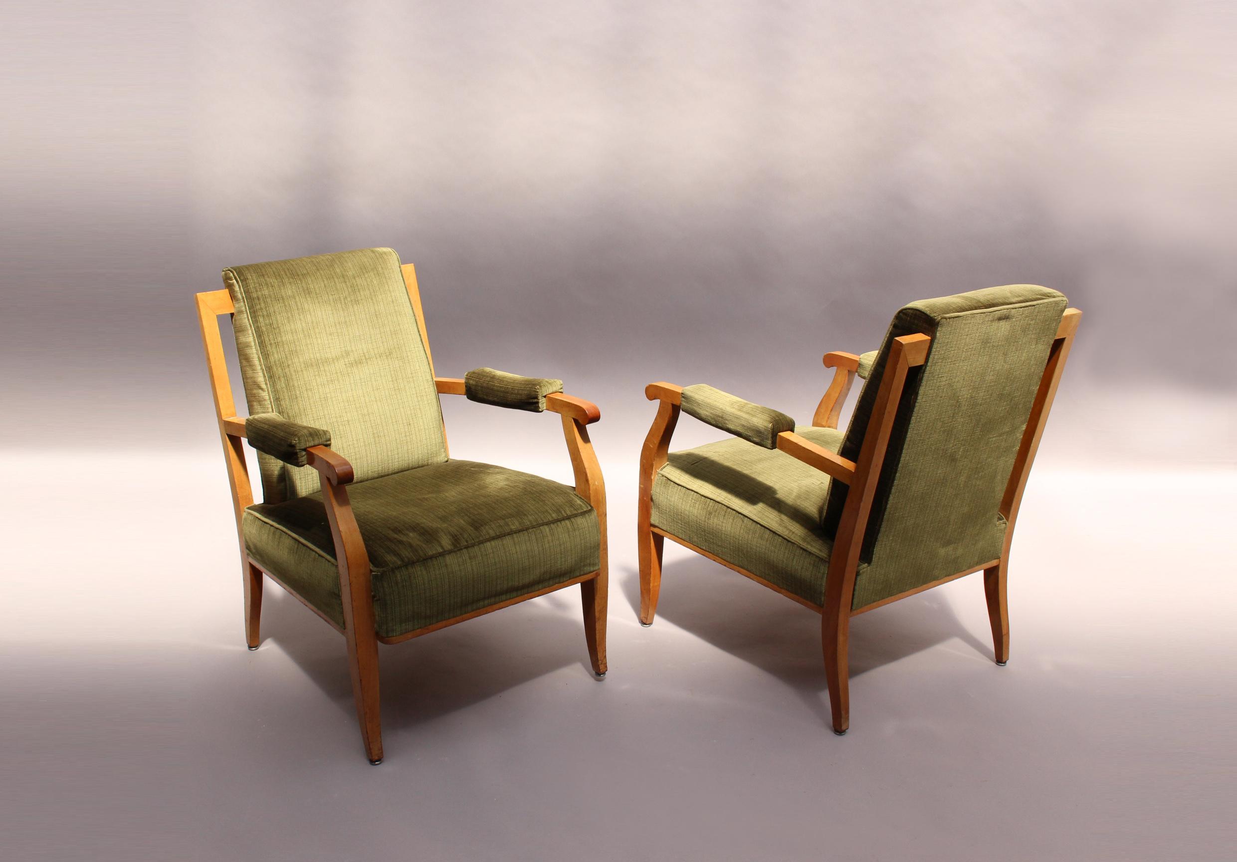 A pair of fine French Art Deco cherry wood armchairs by Jules Leleu.