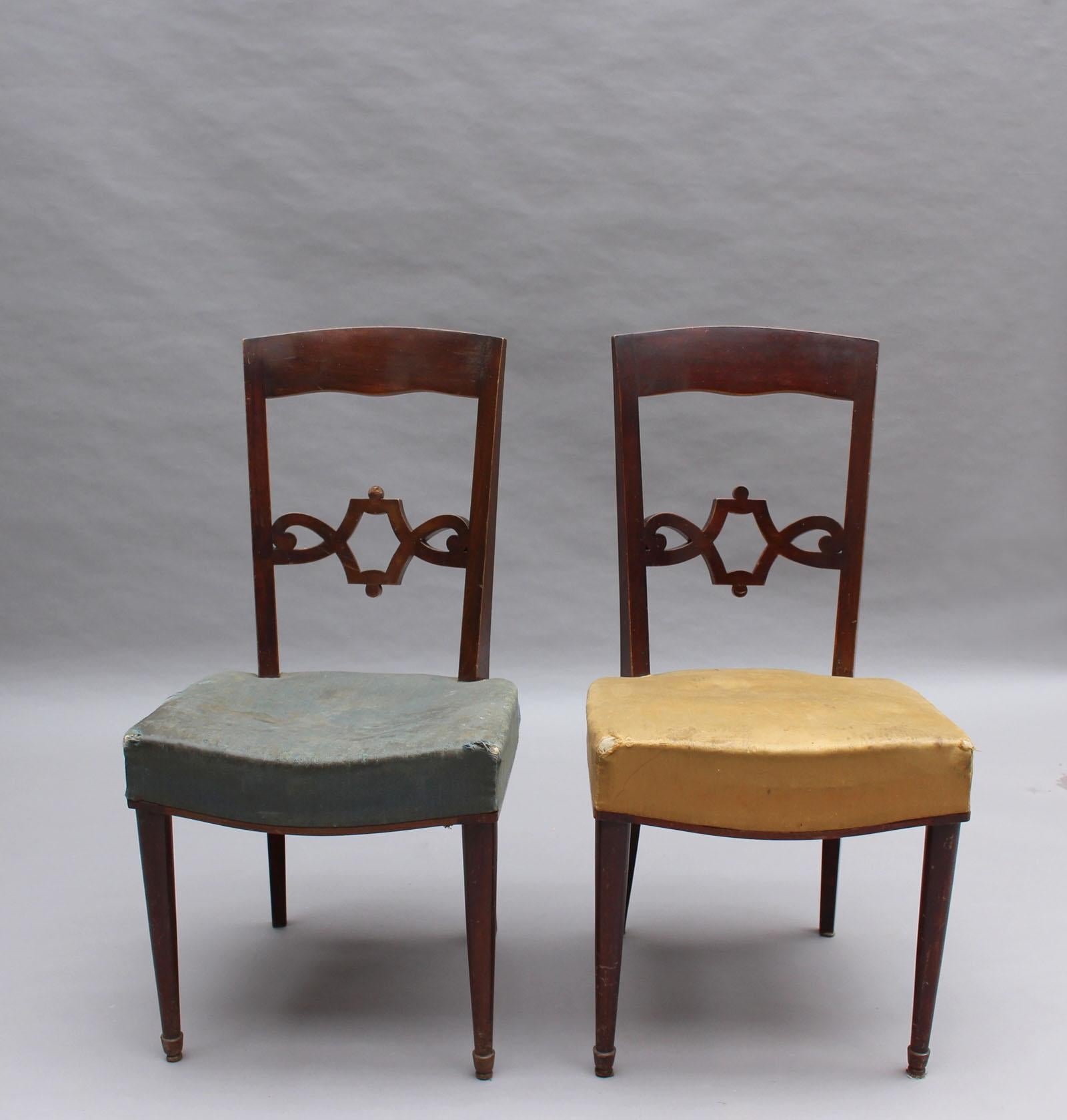 Jules Leleu- A pair of fine French 1940s mahogany chairs with intertwining curved wood backs

Numbered: 21956 & 21957

For an illustration of a similar armchair, see Siriex, Francoise. The House of Leleu. New York: Hudson Hills Press, 2008. page
