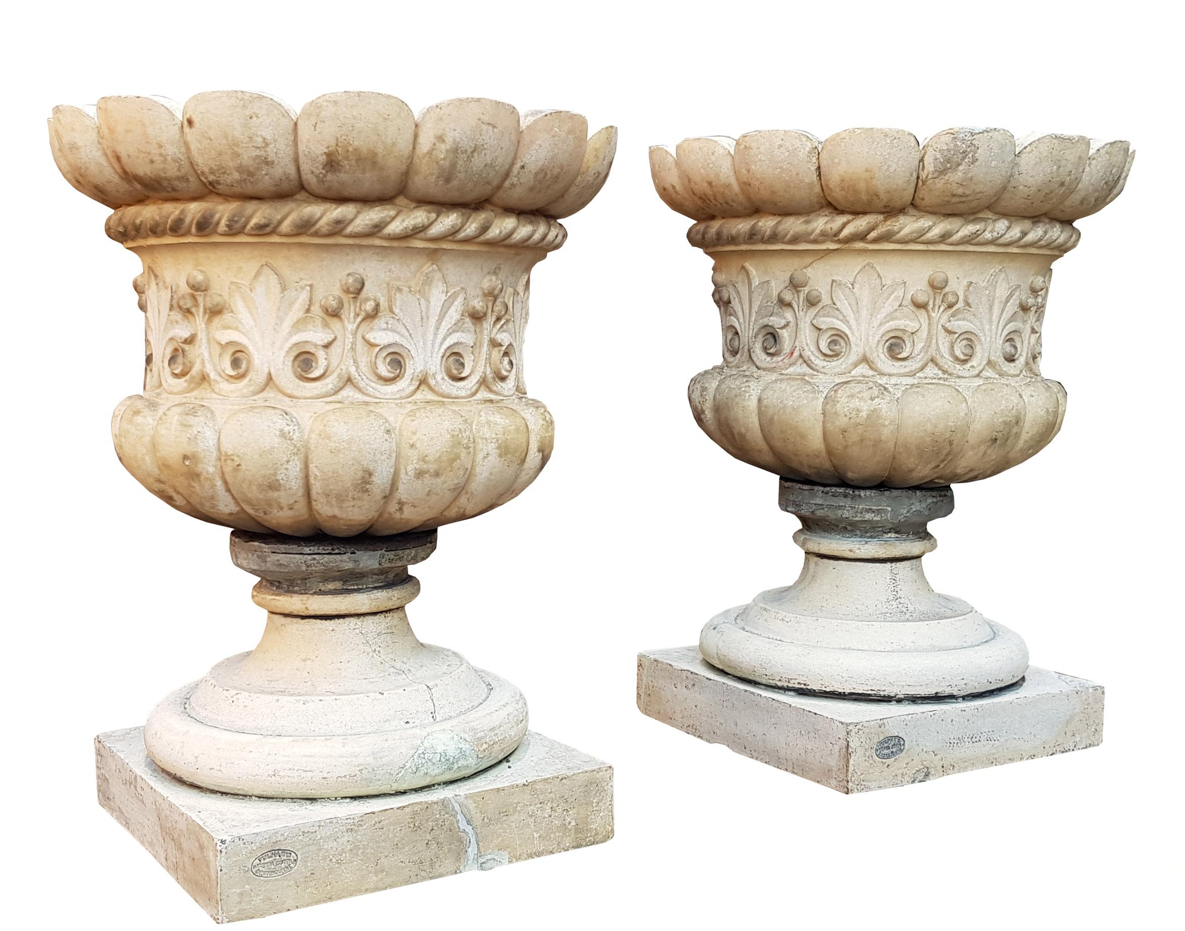 A pair of Fine Pulham garden urns reclaimed from a property in Scotland. Made from Terracotta in Broxbourne, England around 1870. An identical urn is featured in “Antiques form the Garden” Alistair Morris, P. 128. Both bearing clear stamps to the