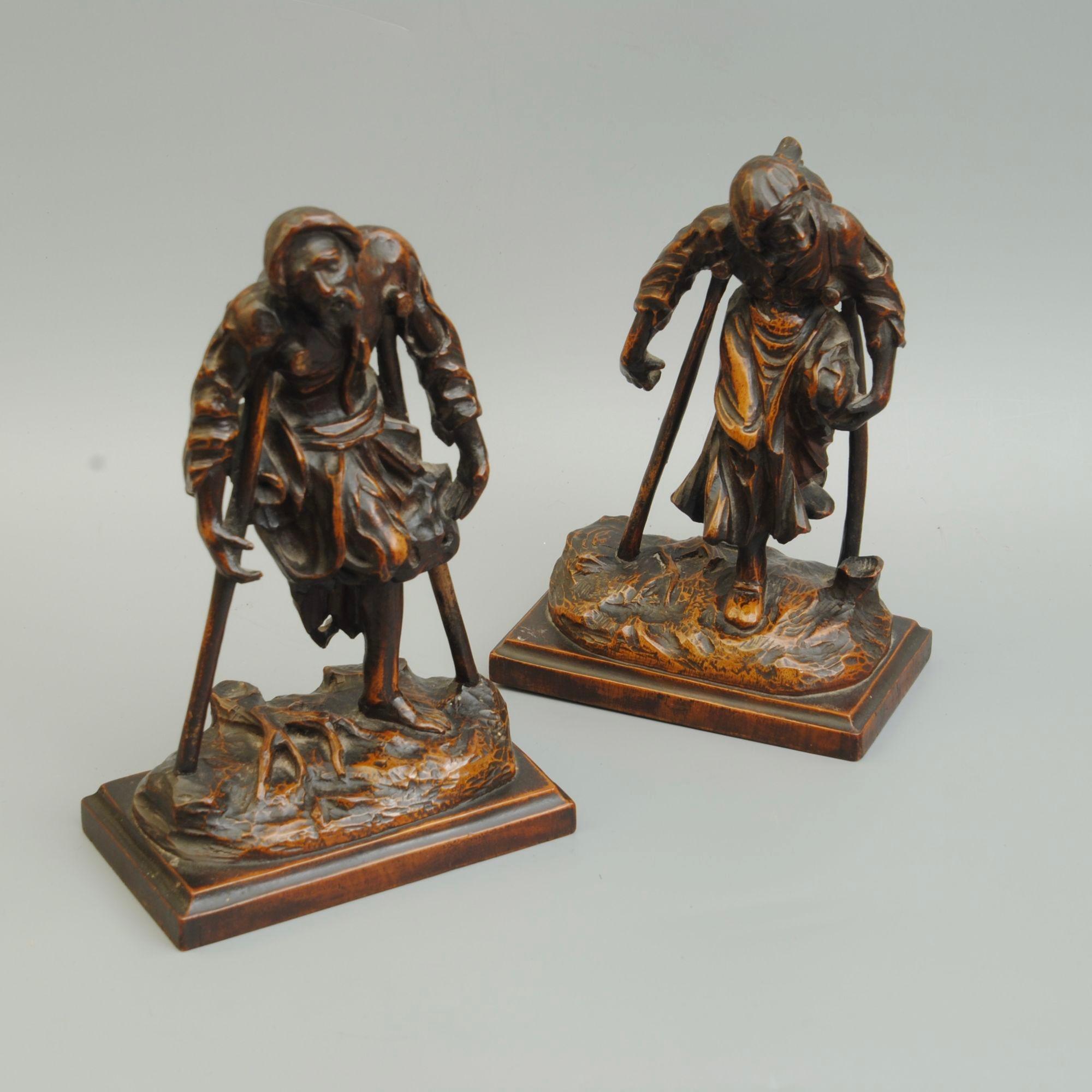A pair of 18th century German figures of one legged beggars after the engravings of Rembrandt in box wood.
Circa 1780