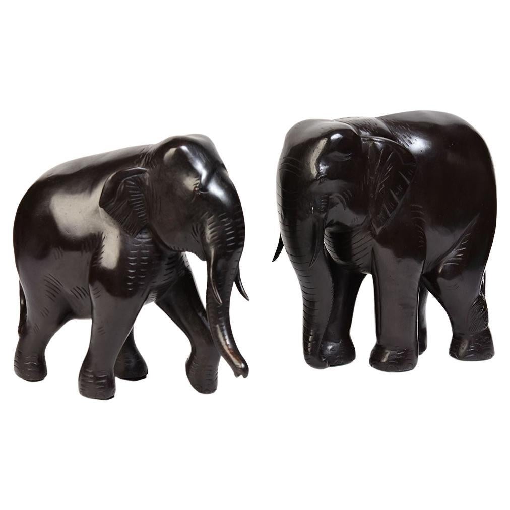 Pair of Finely Cast Asian Bronze Walking Elephant Animal Statues For Sale