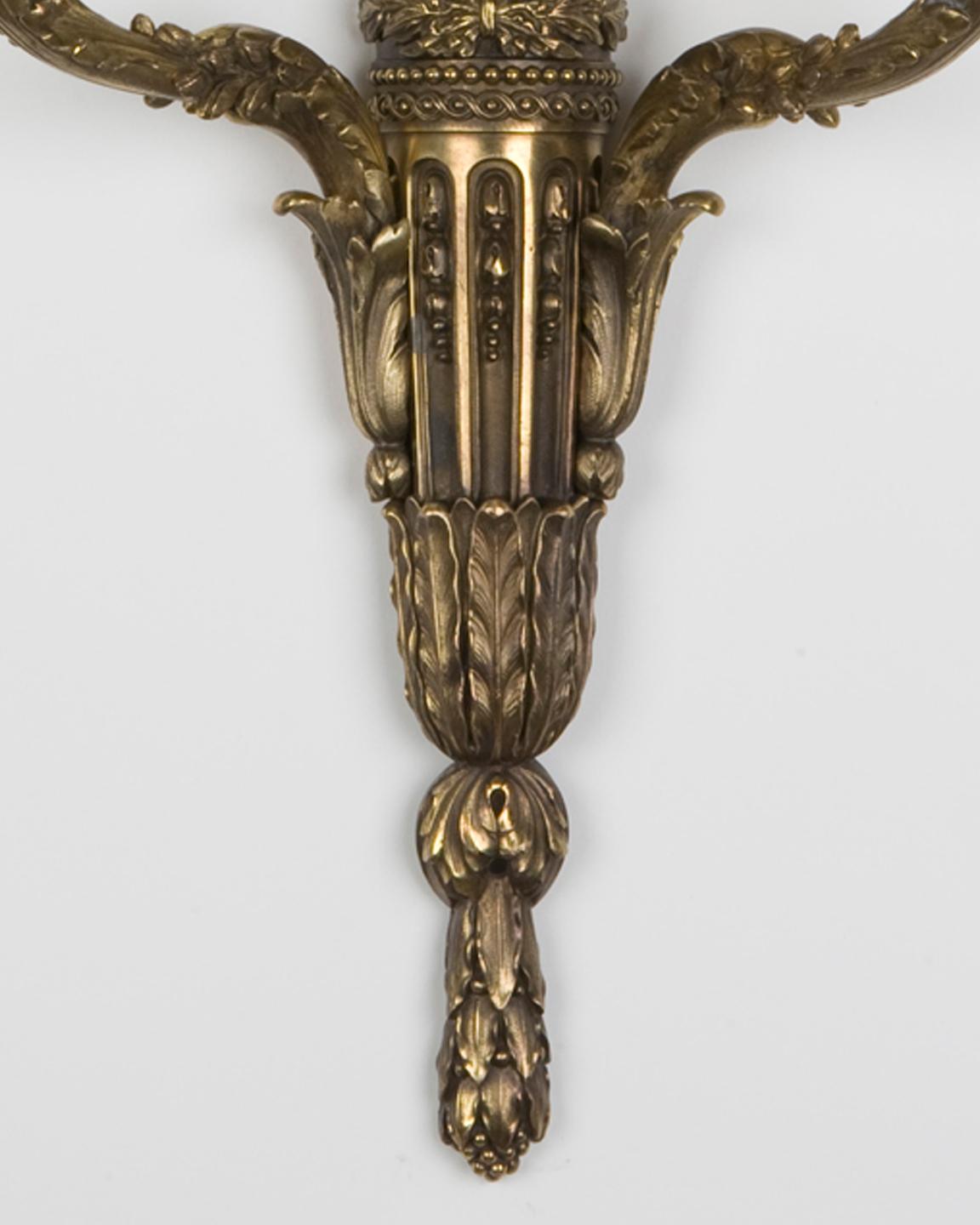 Cast brass two arm sconces with foliate details by E. F. Caldwell Co. Circa 1900 In Good Condition For Sale In New York, NY