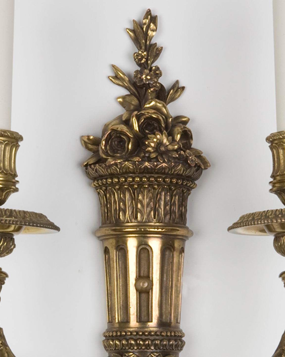 American Cast brass two arm sconces with foliate details by E. F. Caldwell Co. Circa 1900 For Sale