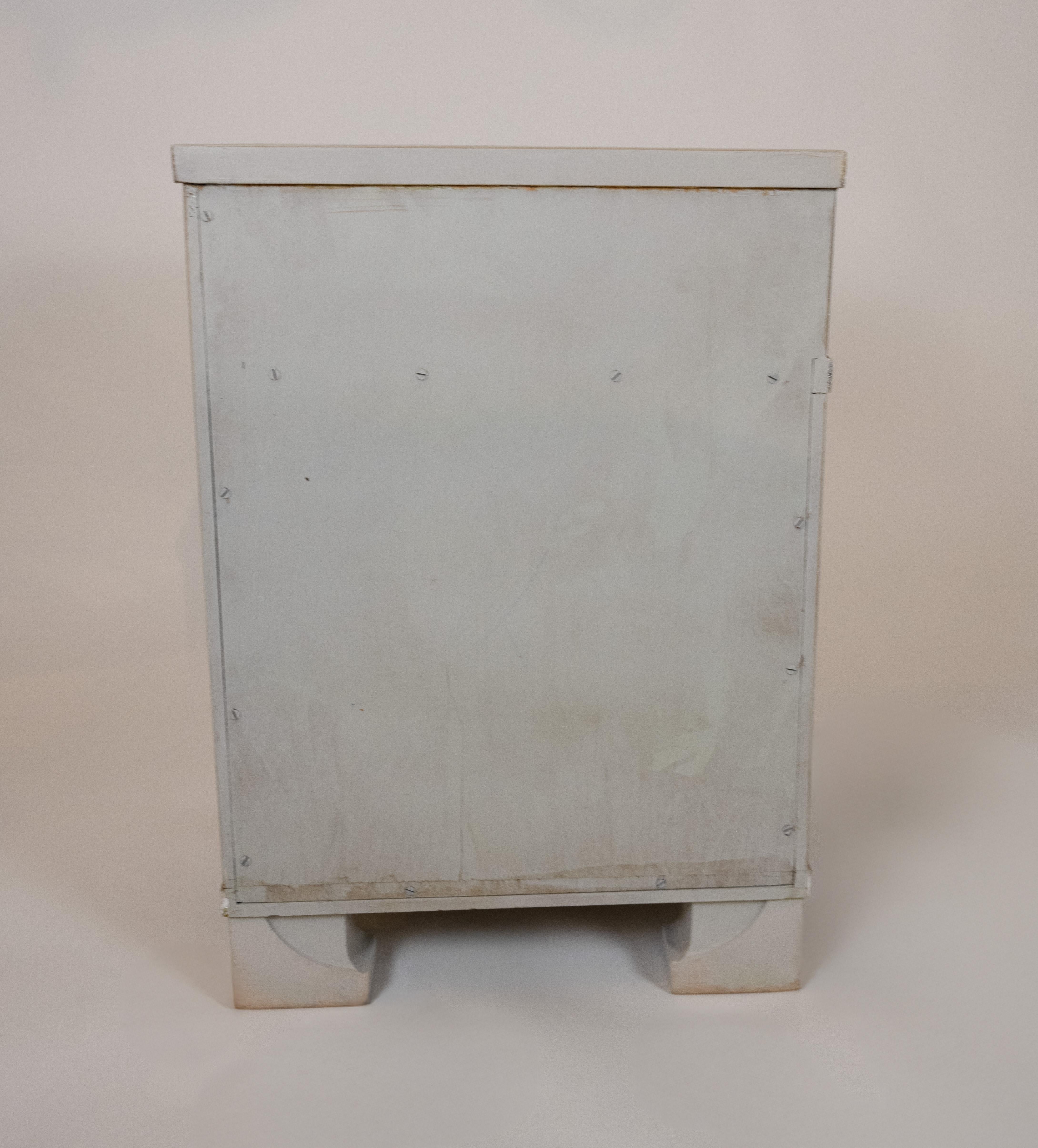 A pair of Finnish Art Deco side tables made by Venesta Finland. Newly painted in Farrow & Ball Cornforth White with an artisan patina and a white gold leaf trim. Circa 1930.