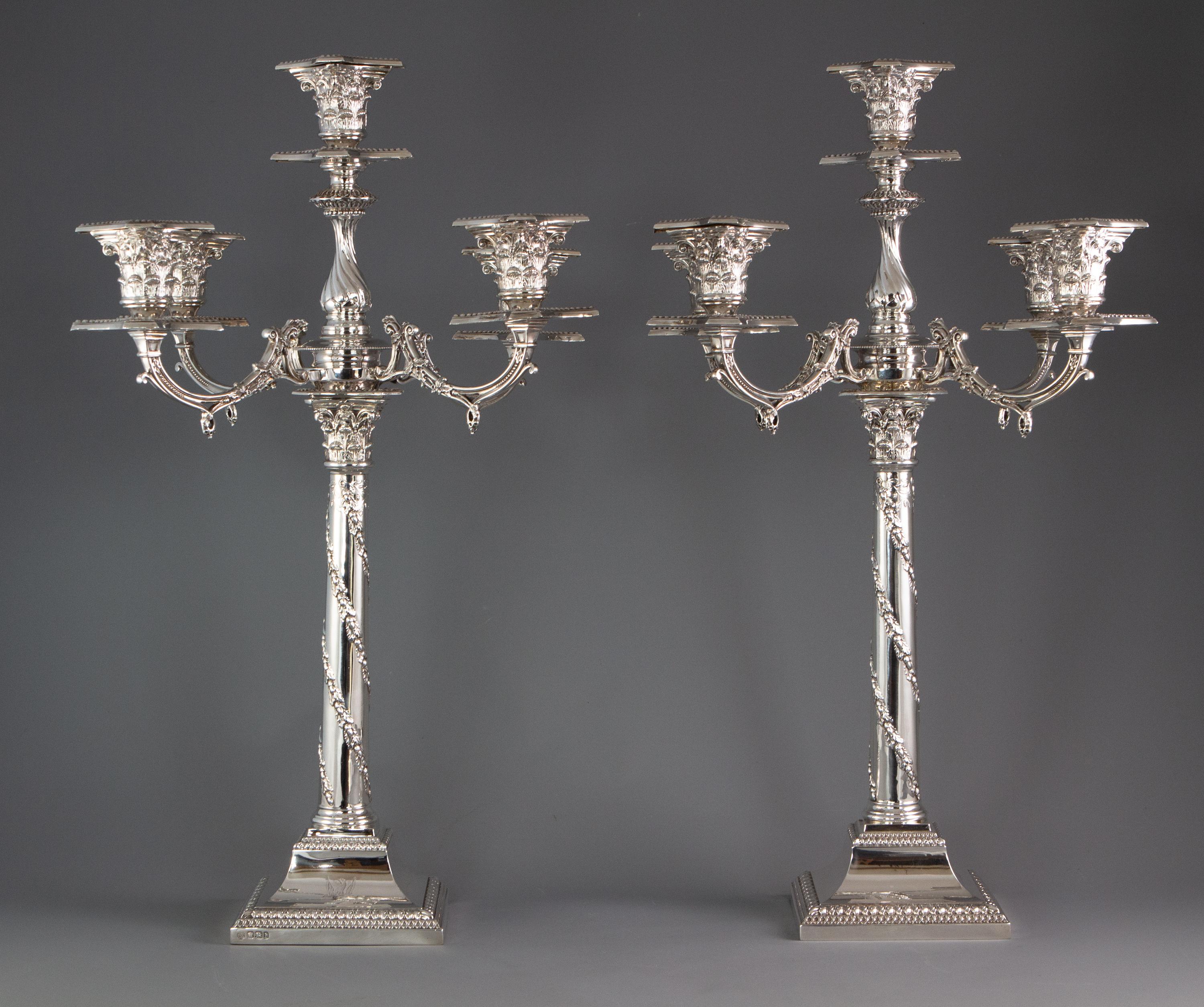 An impressive pair of five light Victorian silver candelabra Sheffield 1894

An extremely good pair of five light Victorian silver candelabra of classical form. The sticks rise from a moulded square section beaded and leaf bordered base to a plain