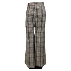 A pair of flared trousers in checked wool tweed – France, circa 1972