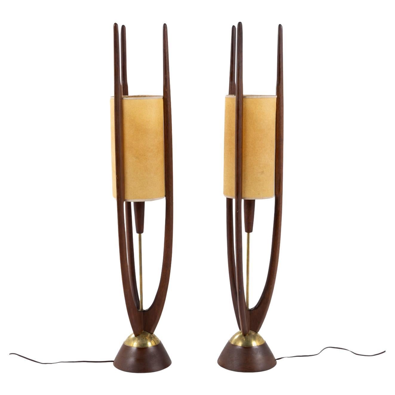 A pair of floor lamps in walnut by John Keal For Sale