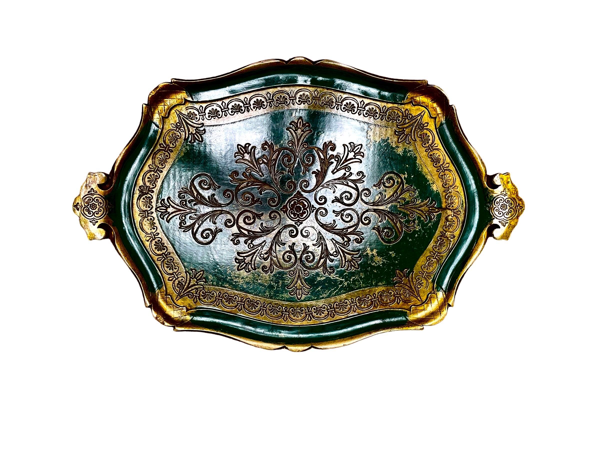 A Pair of Florentine papier mache trays with carved borders and handles and scroll cut carved swirling decorations.
Excellent patinas 

19.5 inches long 