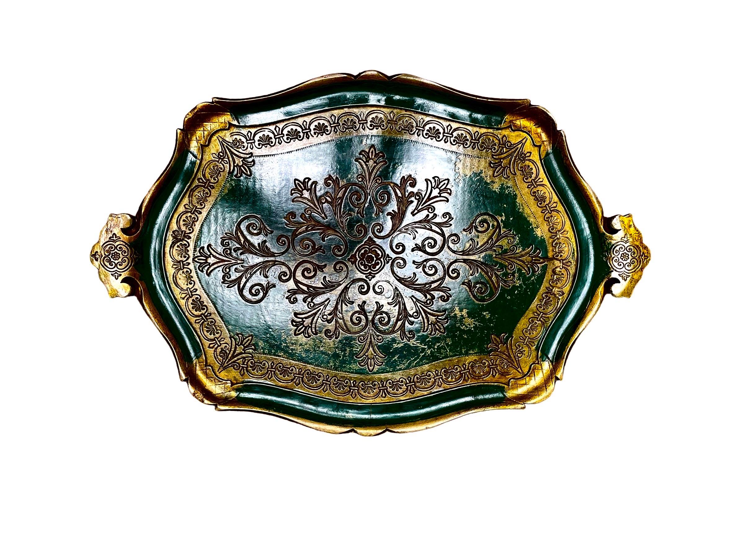 A Pair of Florentine papier mache trays with carved borders and handles, scroll cut carved swirling decorations.
Excellent patinas 

24