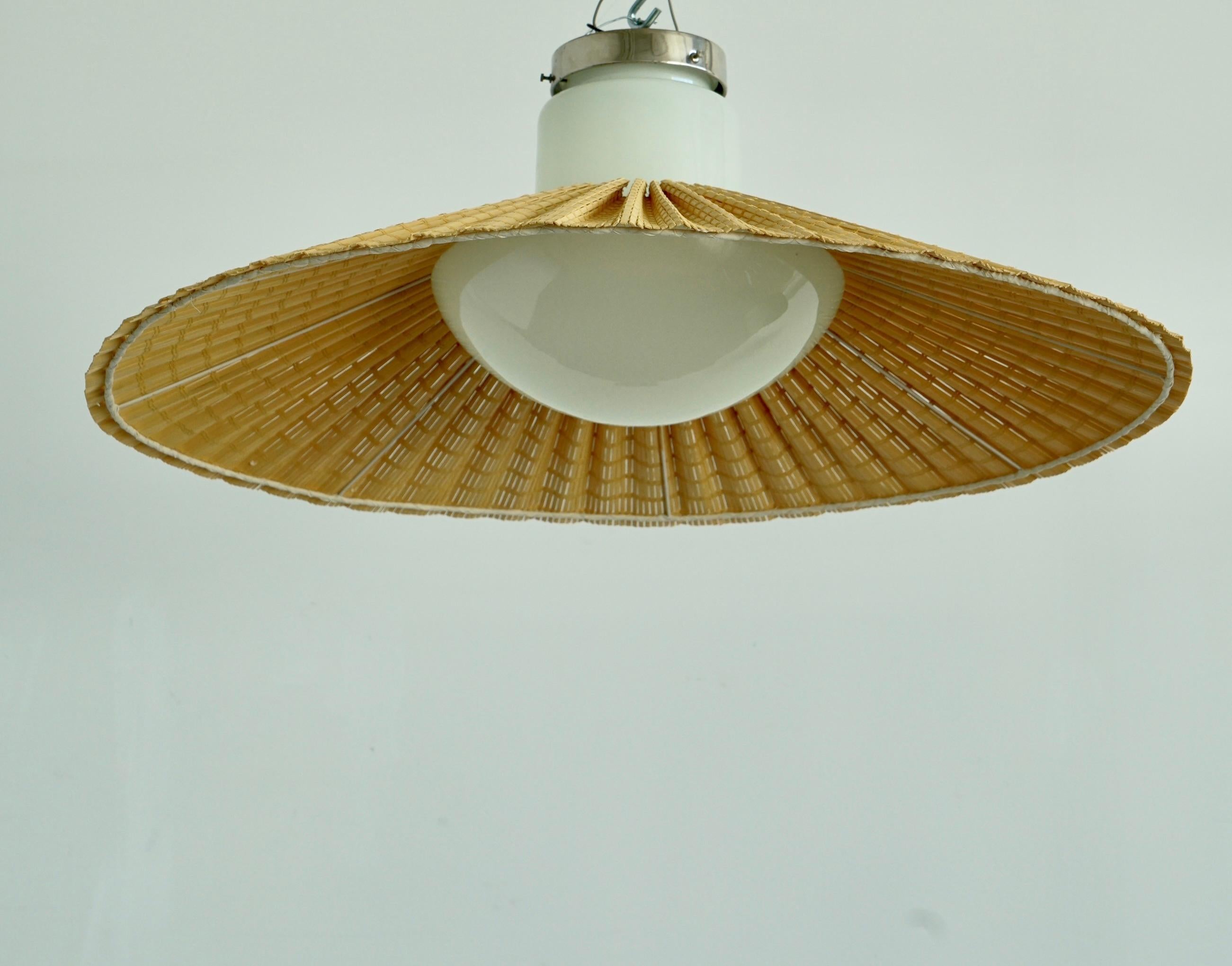A pair of flush mount ceiling light designed by Paavo Tynell for Taito Oy, Circa 1935. Opaline glass shade with wooden wiser. Stamped 