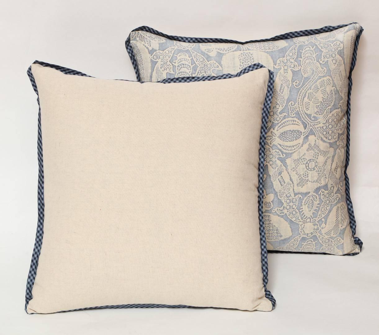 A pair of Fortuny fabric cushions, pale blue, with miniature gingham bias edging and Holland and Sherry cashmere fabric on the back.
50 down/50 feather insert 
Newly made using rare and early Fortuny fabric, circa 1920.