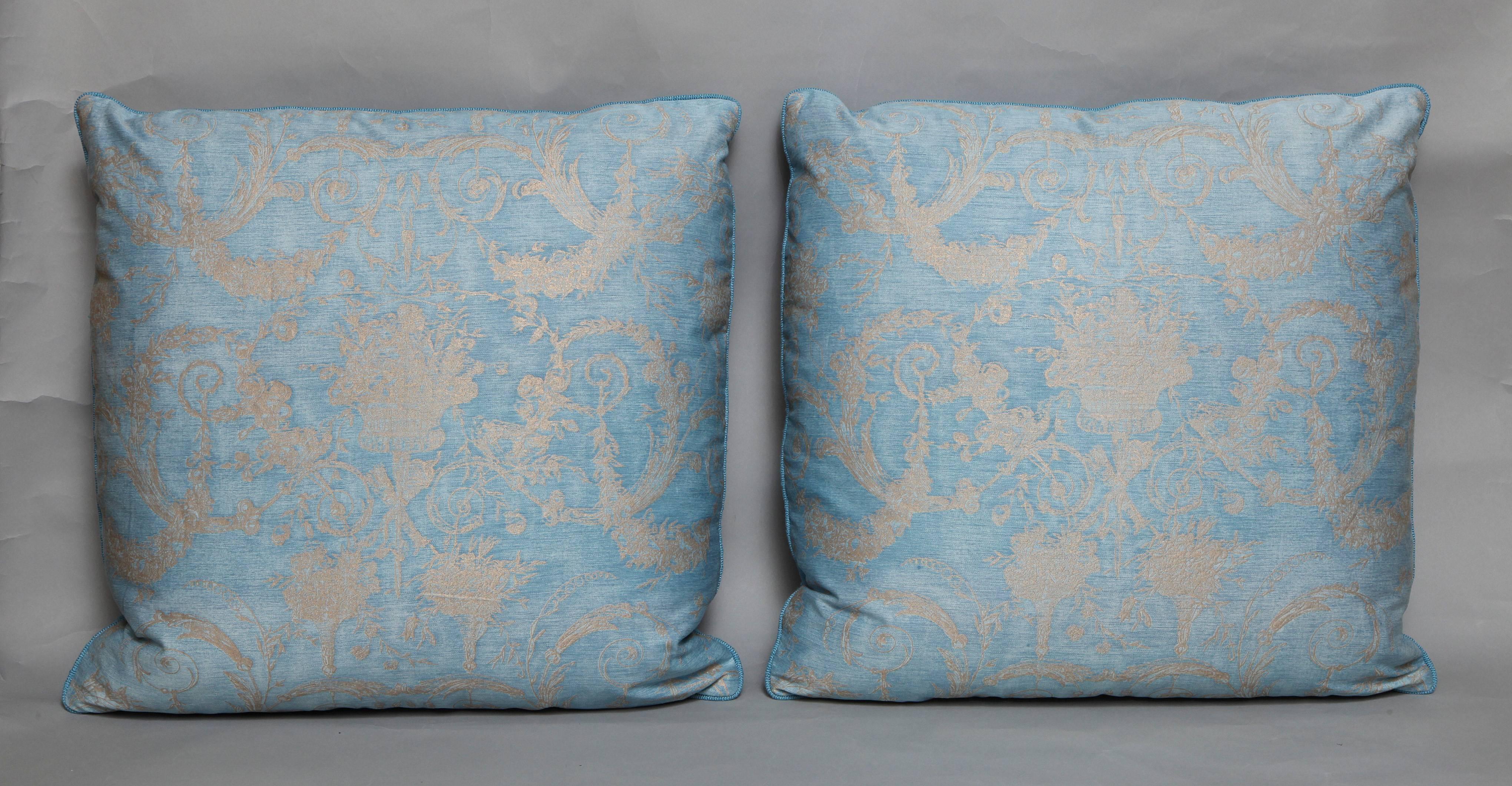 A pair of Fortuny fabric cushions in the Festoni pattern, powder blue with sky blue linen welt trim and silk blend backing, the pattern, an 18th century French design with festoon motif
50 down/50 feather
Newly made using vintage Fortuny fabric,