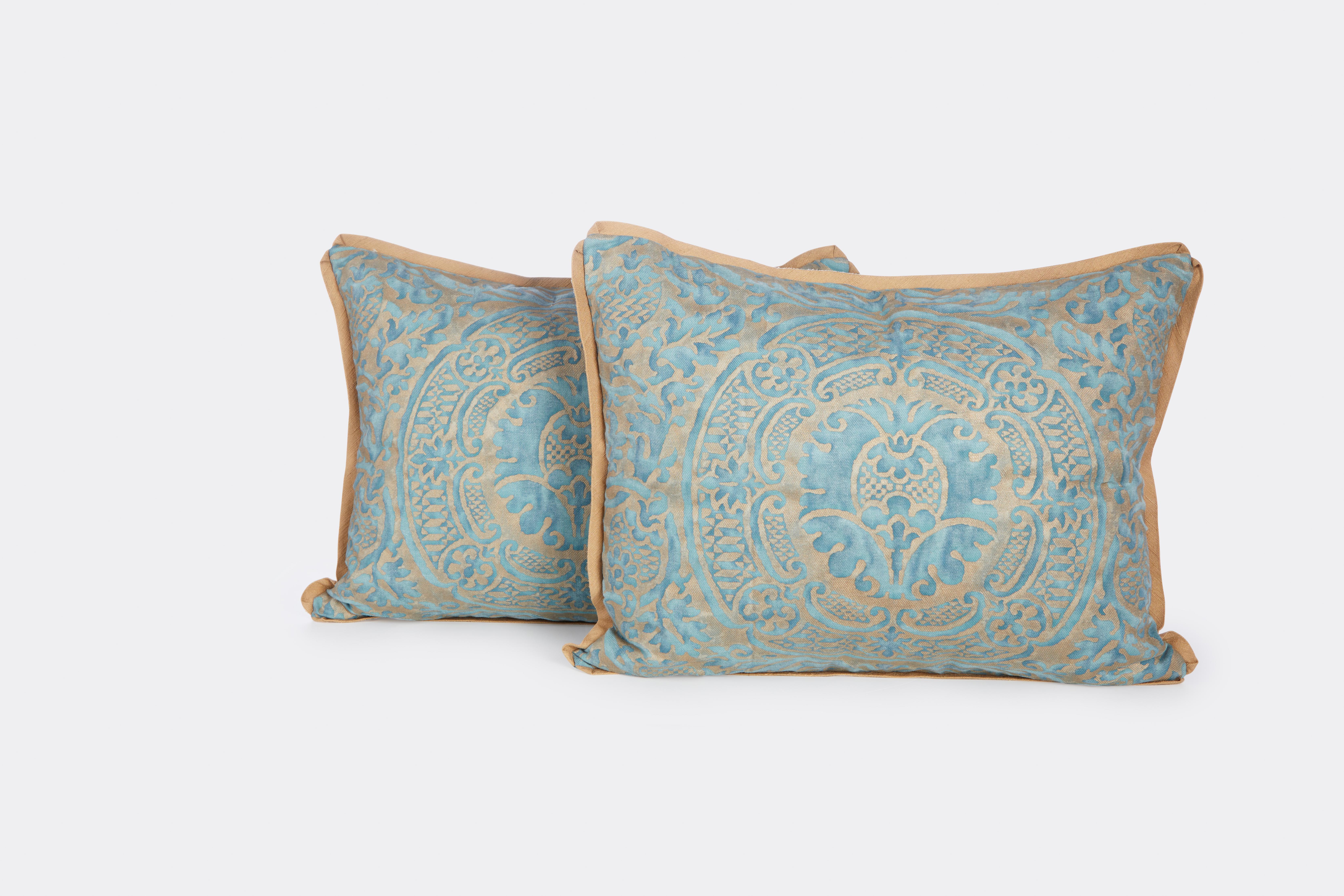 A pair of Fortuny Orsini Cushions in blue/ green with silvery gold and gold bias silk edging and blue silk backs, made by David Duncan Studio. 

50 down/50 feather insert.
All sales are final 