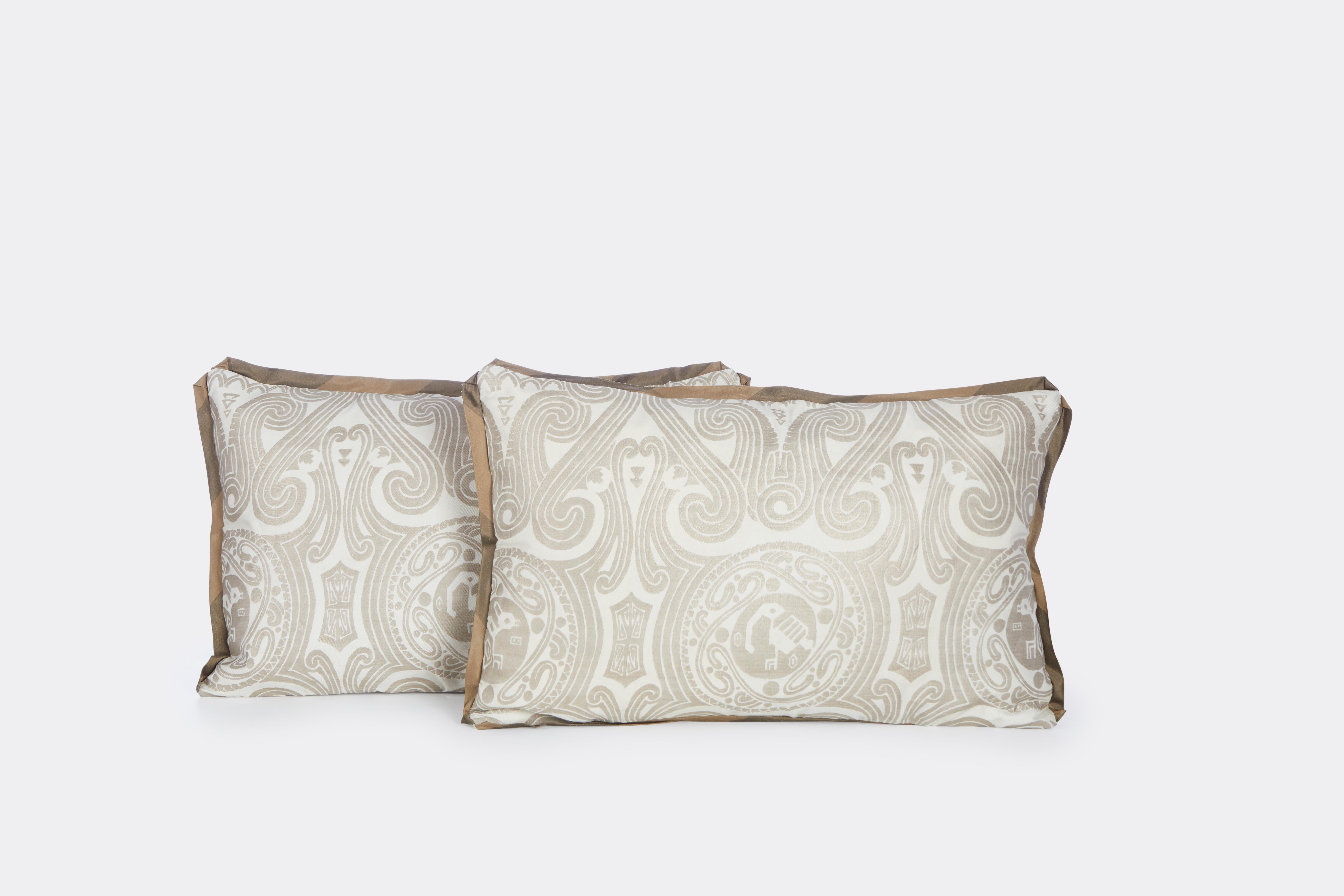 A pair of Fortuny Peruviano cushions ion silvery gold on white with striped bias edging and linen blend back.

Sales are final 